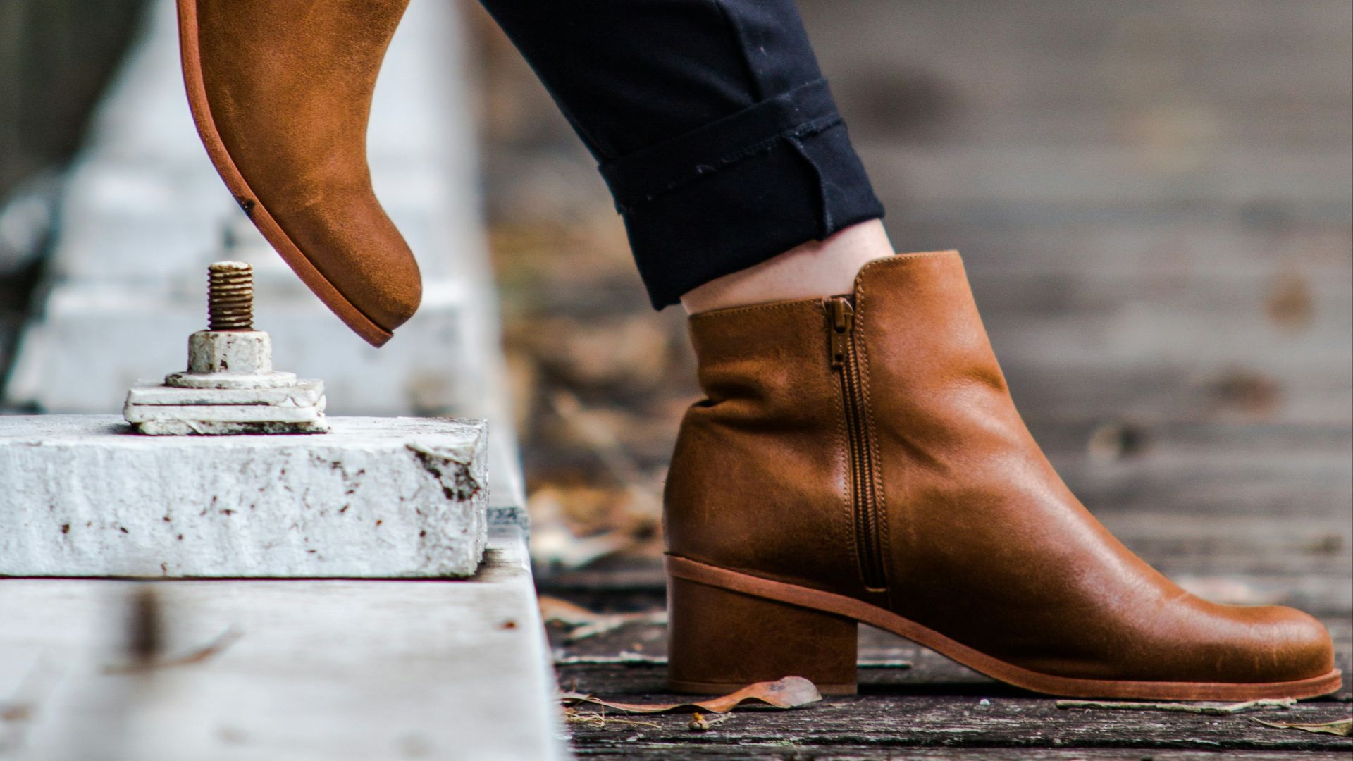 person wearing pair of brown leather dress shoes