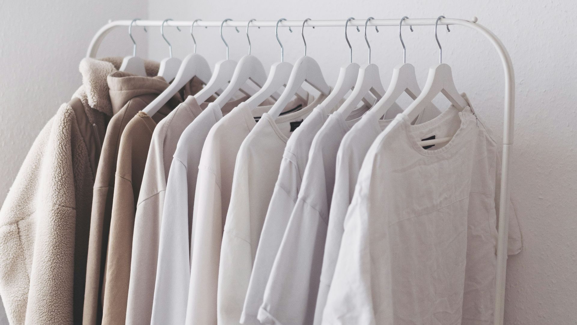 white long sleeve shirt on white clothes hanger