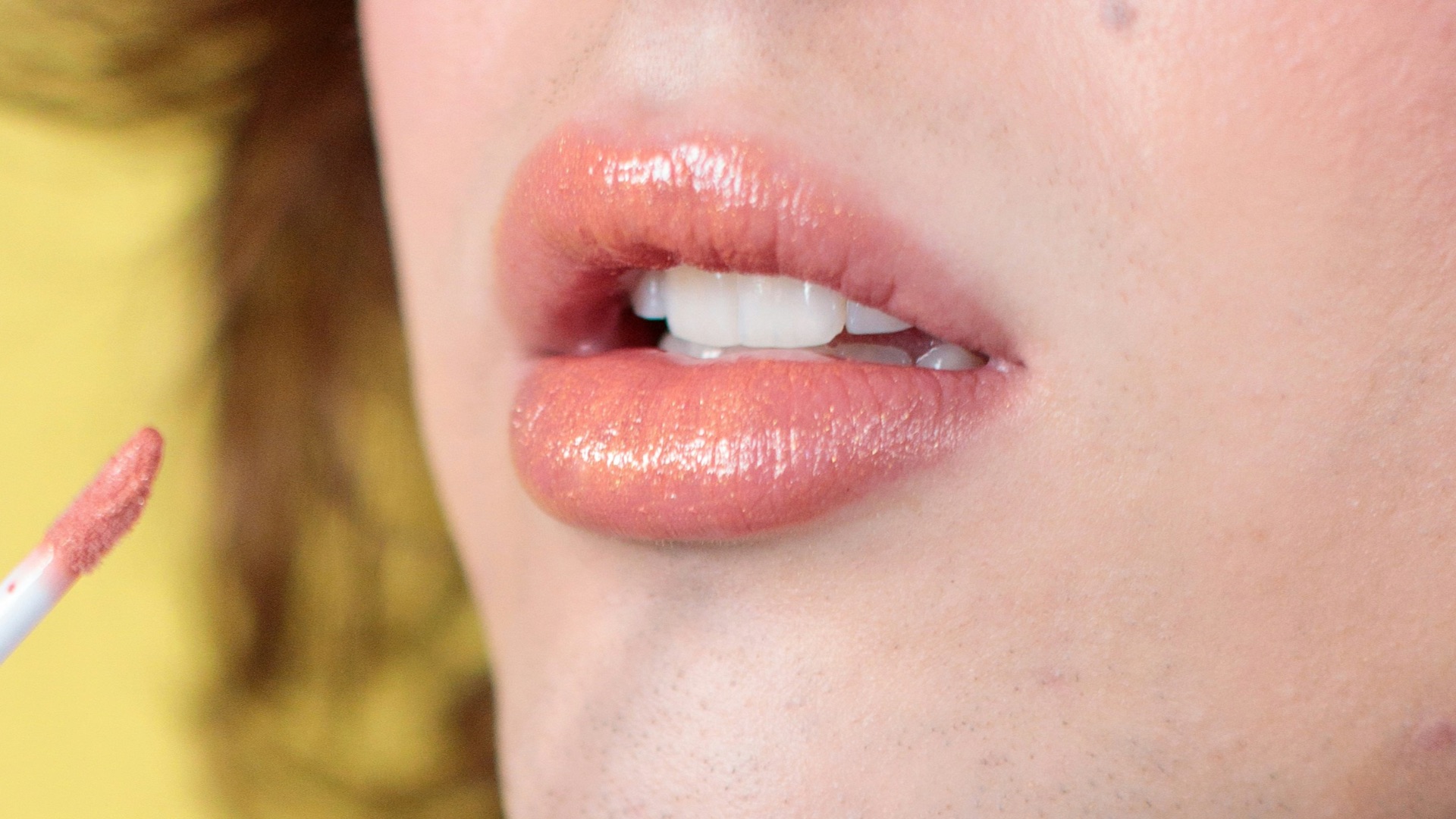 woman in black tank top holding pen