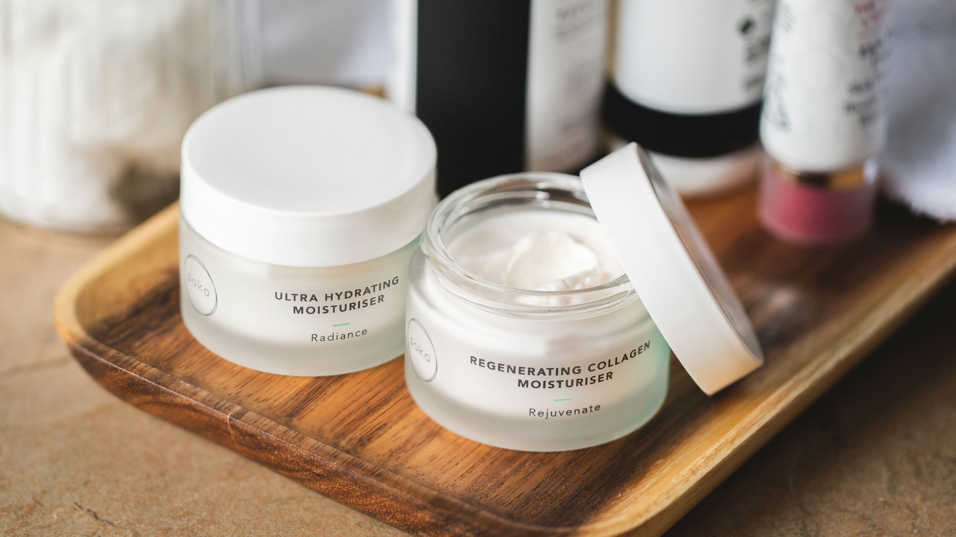 white and clear glass container on brown wooden table