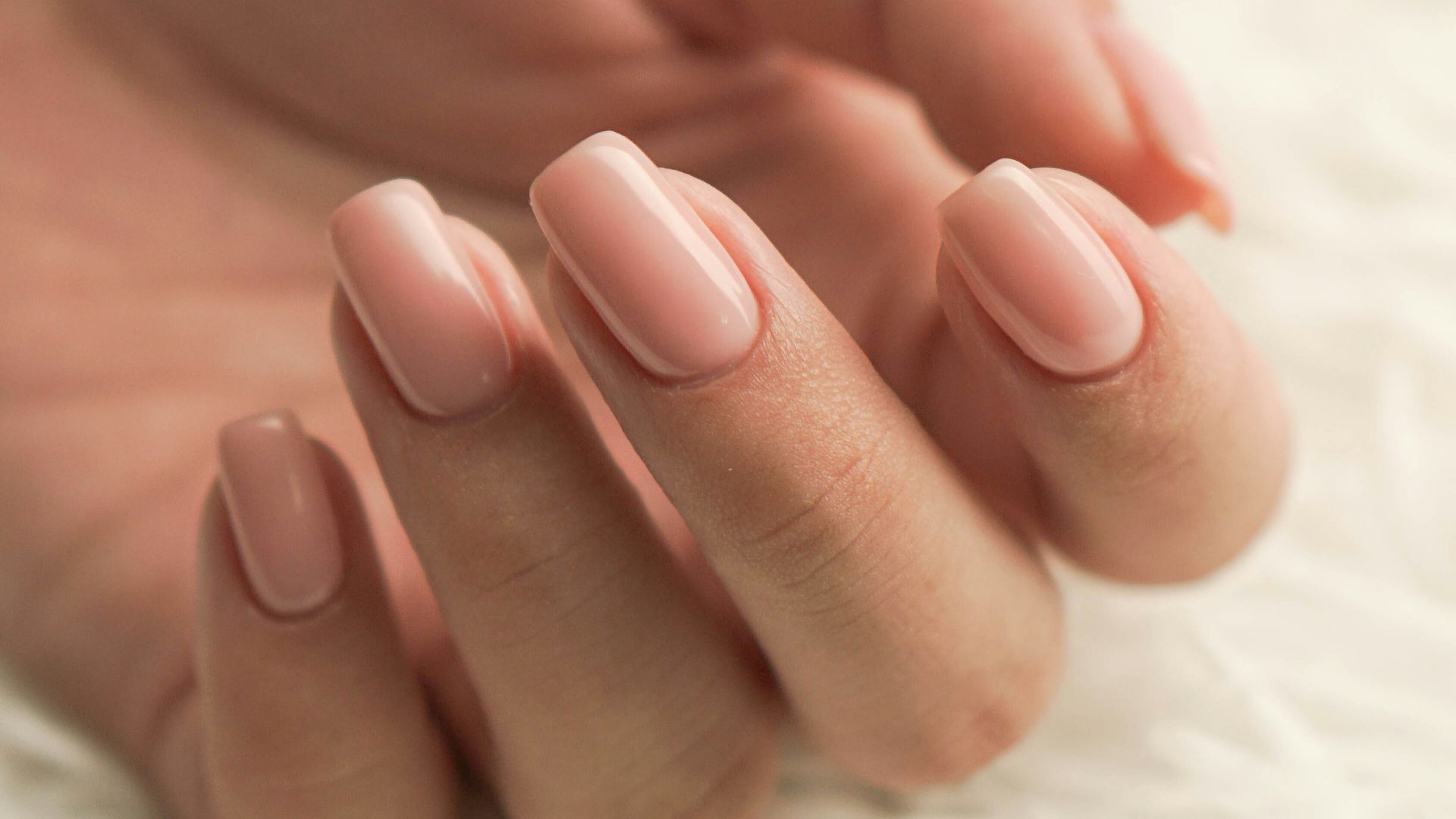 persons feet on white textile
