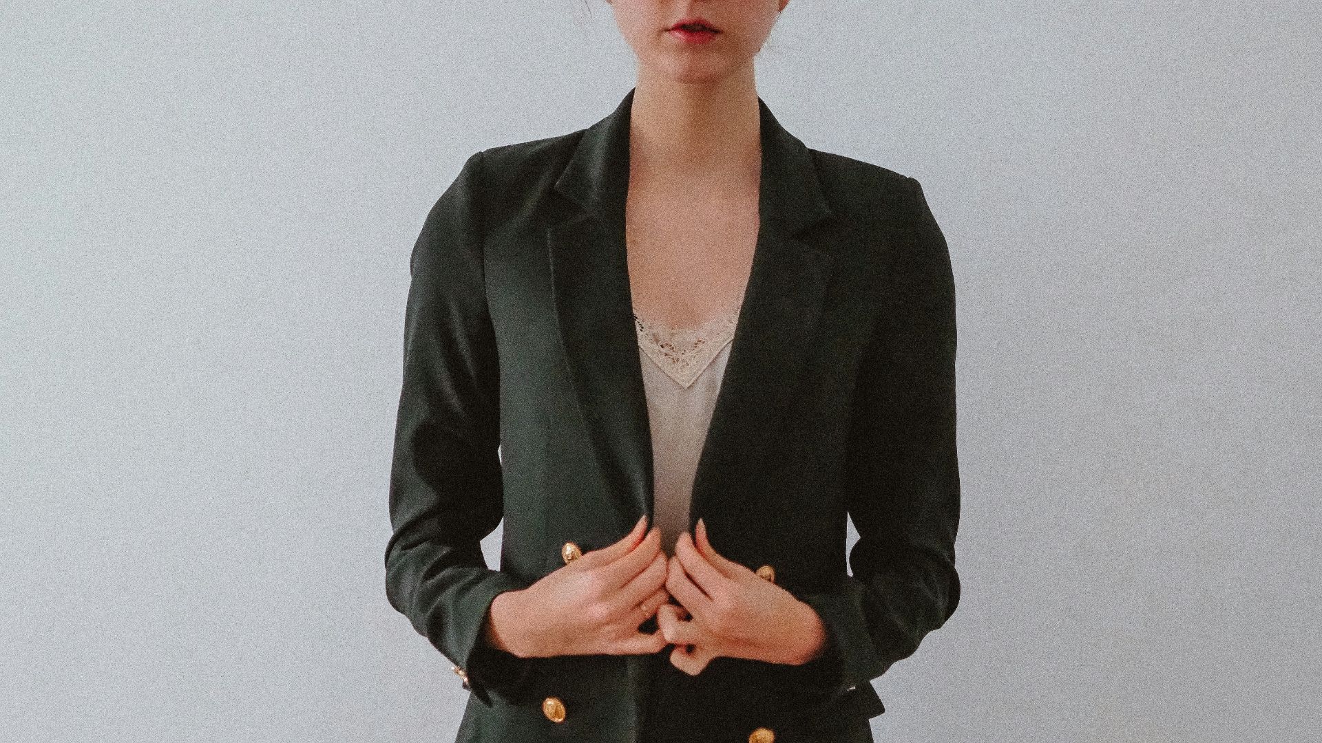 woman in black blazer and black skirt