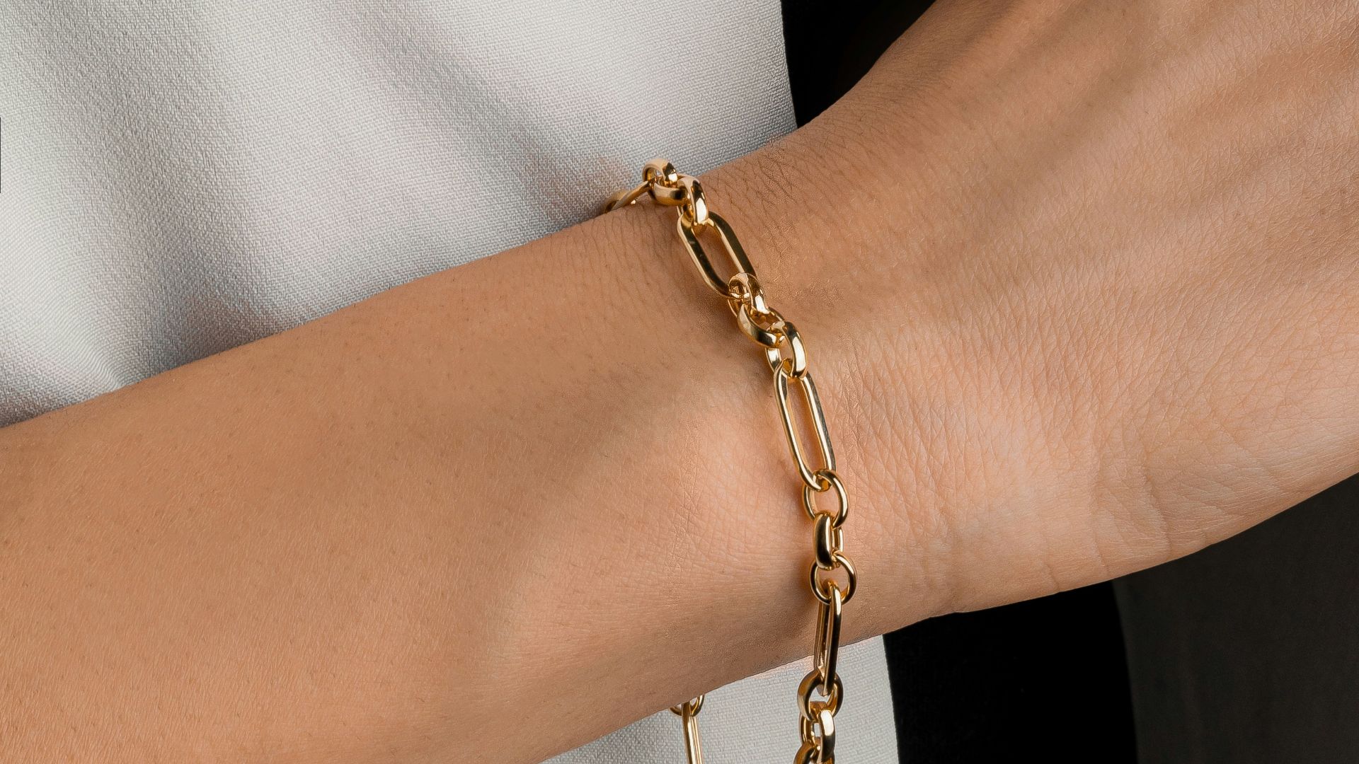 a close up of a person wearing a bracelet