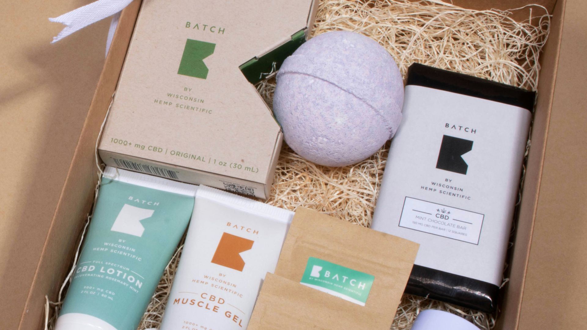 white and brown labeled soft tubes in box