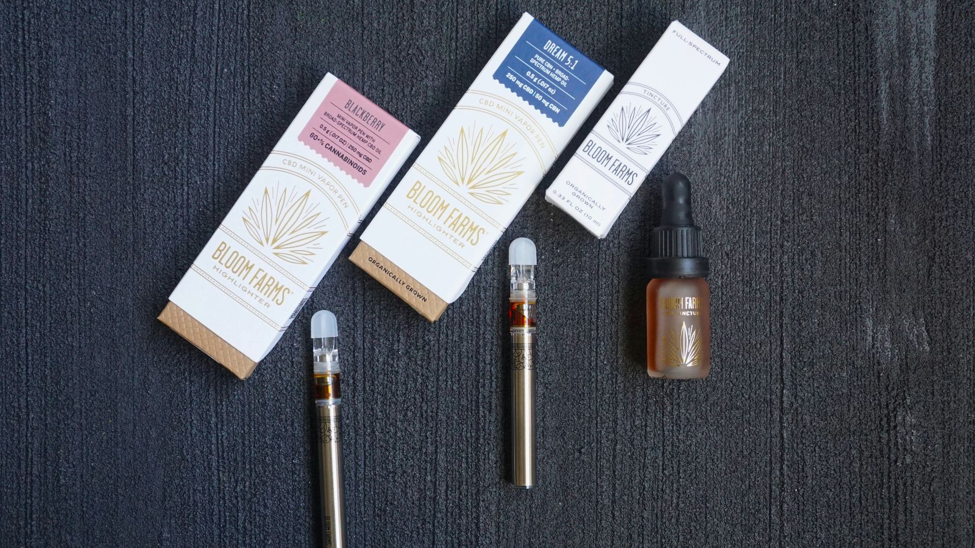 white and blue labeled box beside brown and black tube mod