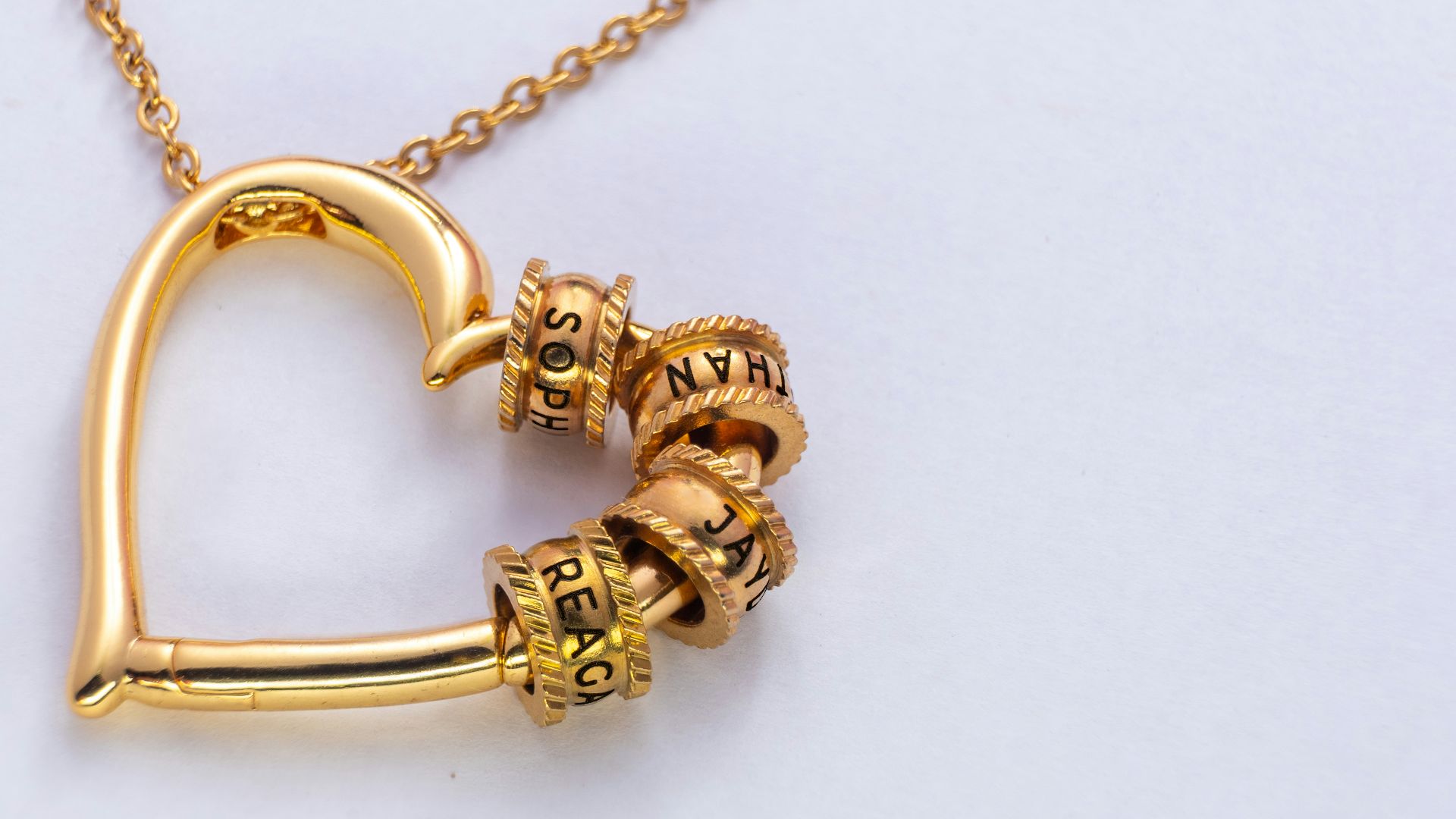 Gold heart pendant necklace with charm beads