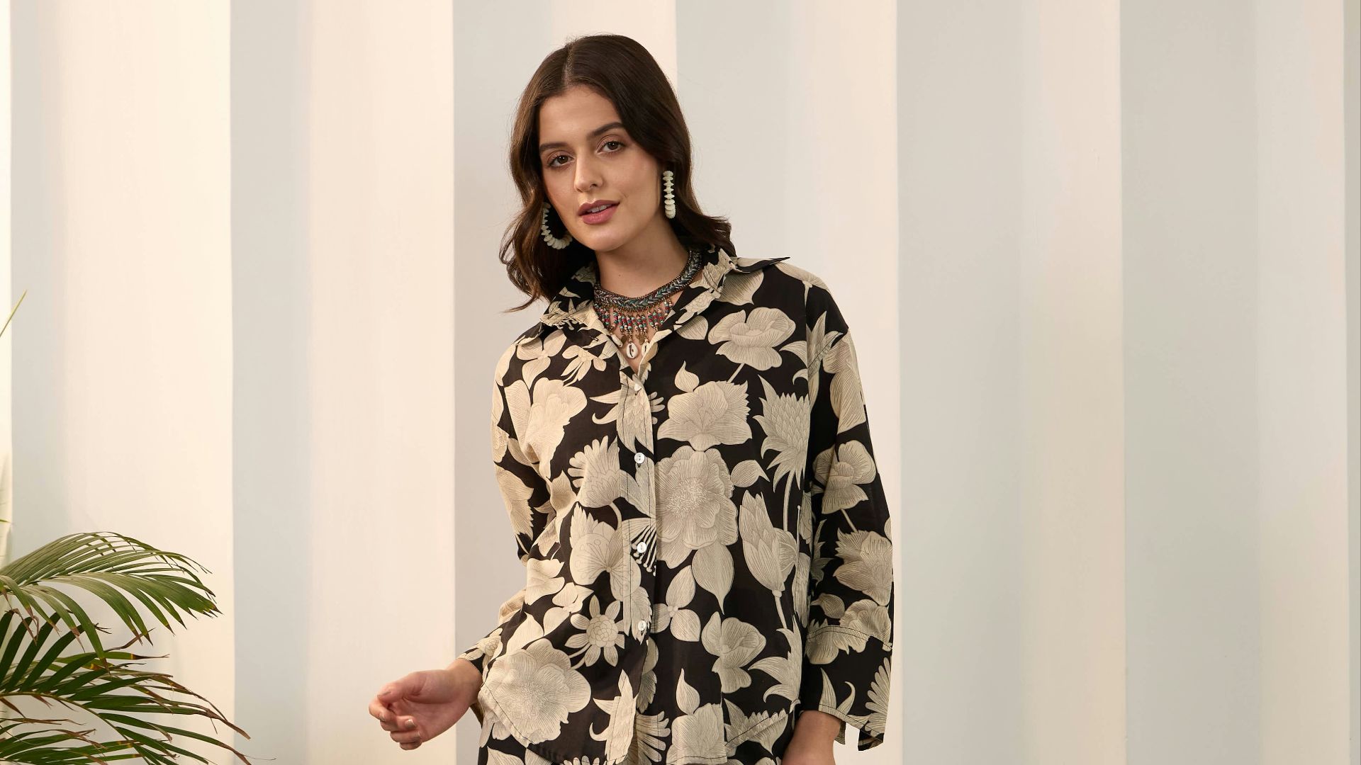 Woman wearing a floral print shirt and pants