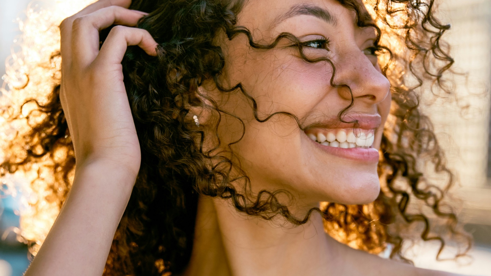 woman in blue tube dress smiling