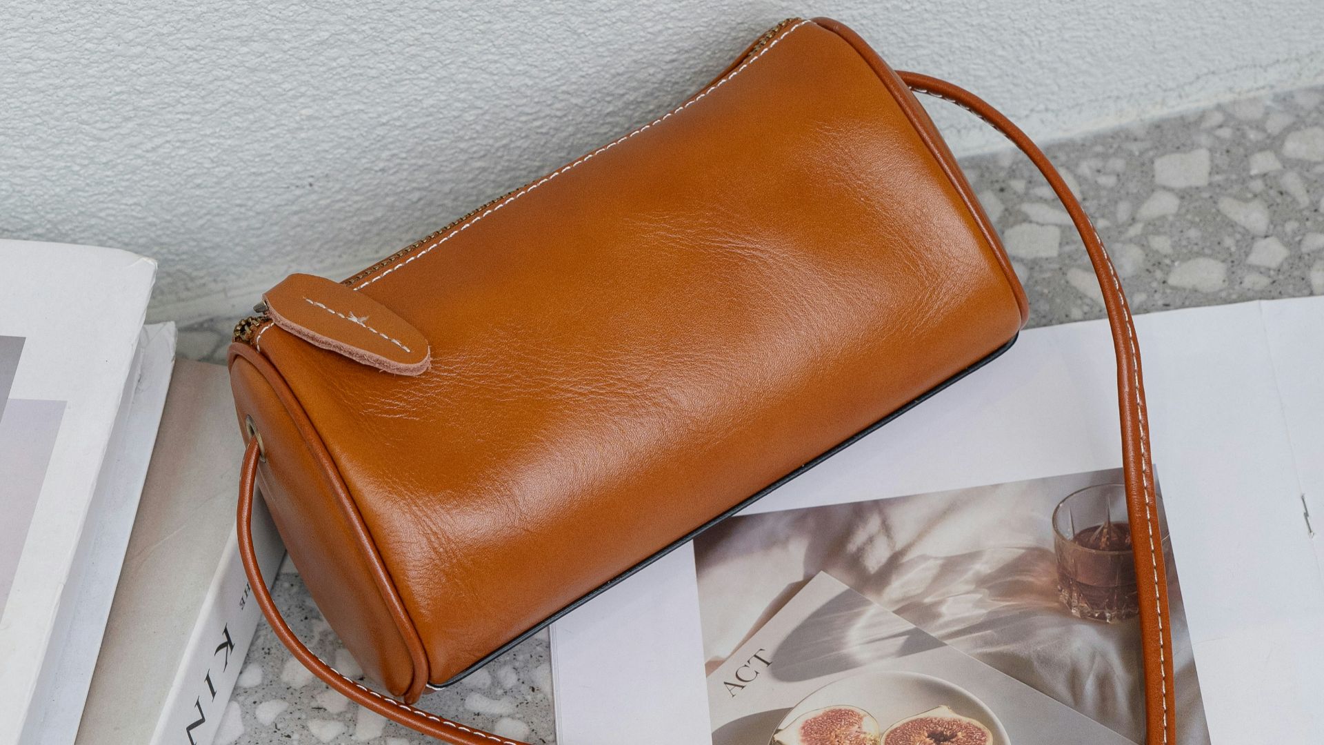 A brown purse sitting on top of a table