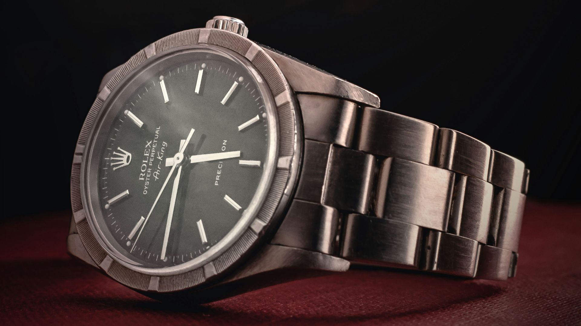 round silver-colored Rolex analog watch with link band