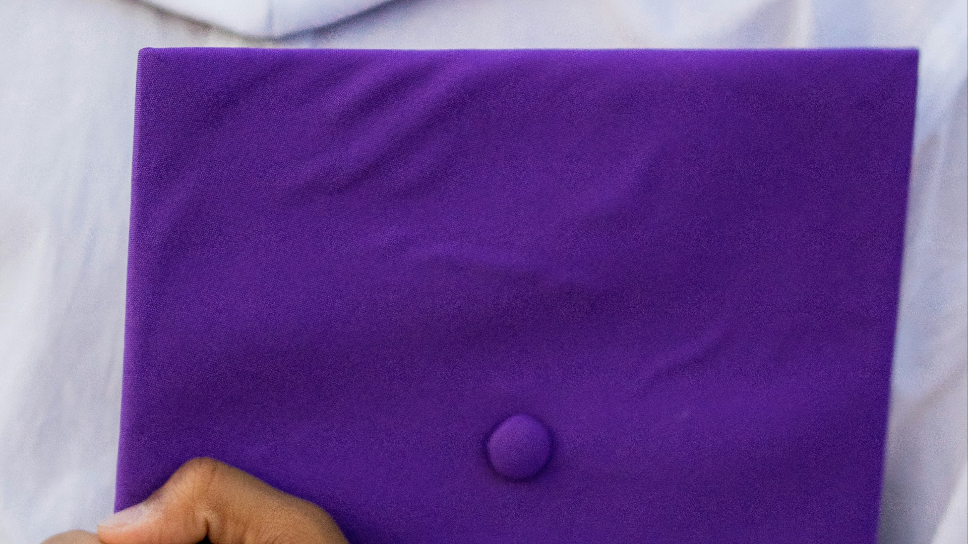 a close up of a person holding a book