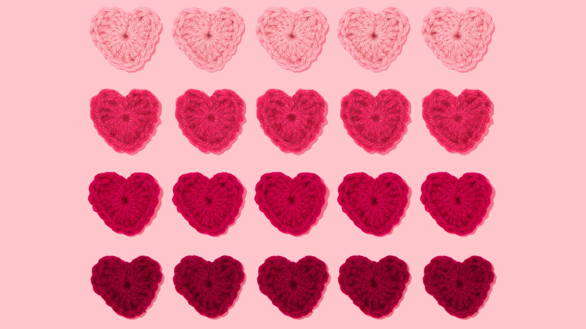 five rows and columns of knitted hearts