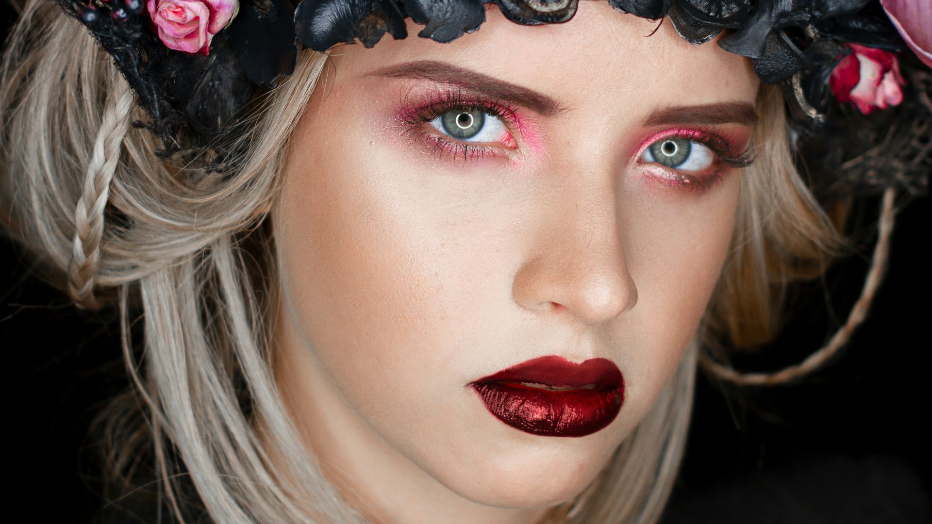 woman wearing black and purple flower headdress
