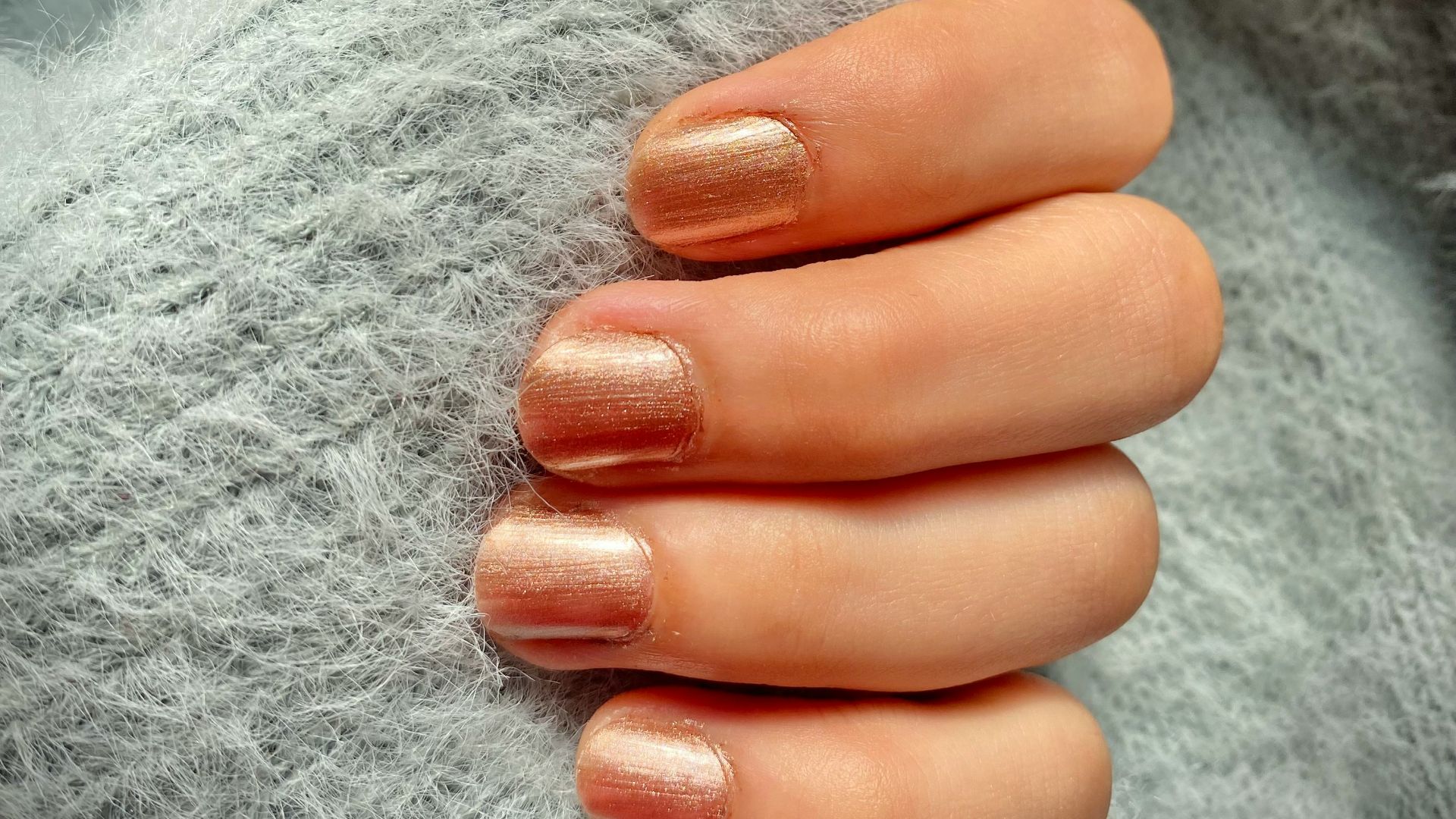 a woman's hand with a manicure on it