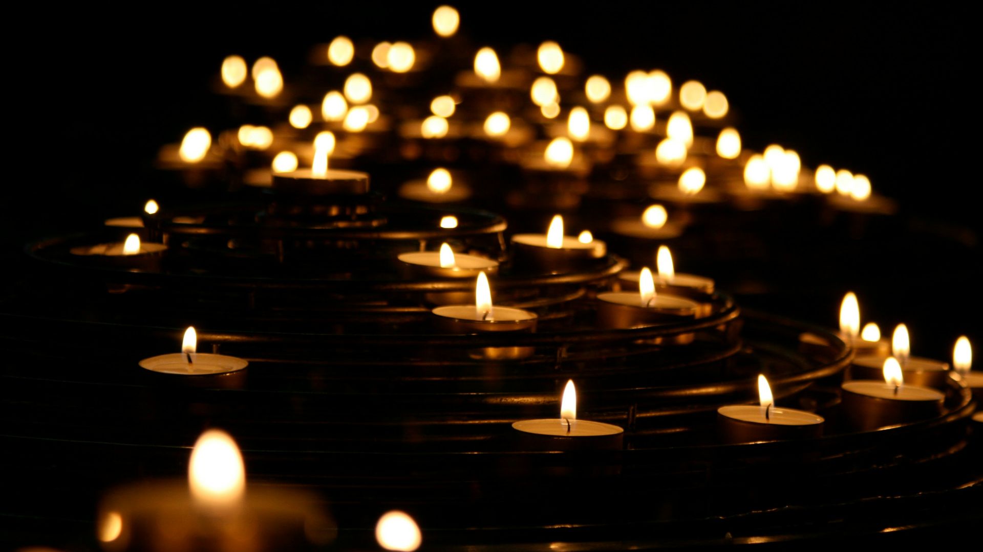 low-angle photo of lightened candles