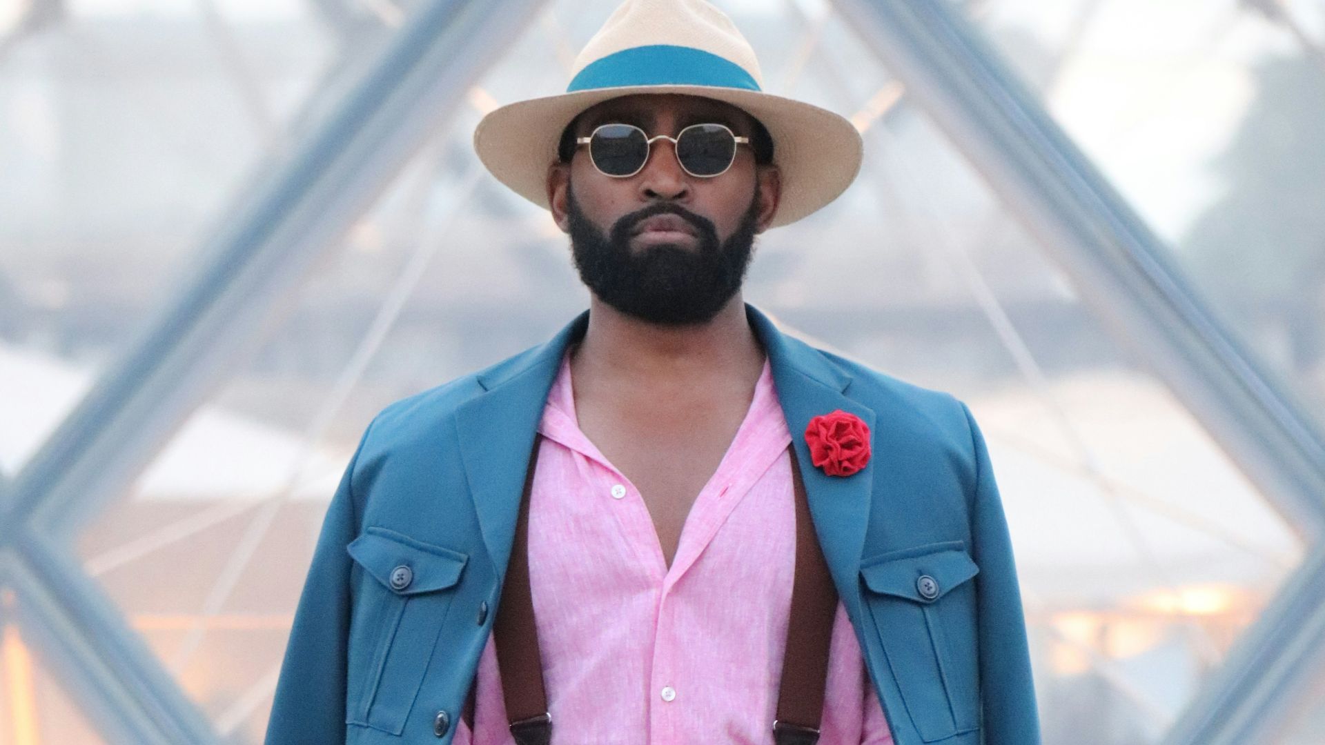 Man in stylish suit with hat and sunglasses