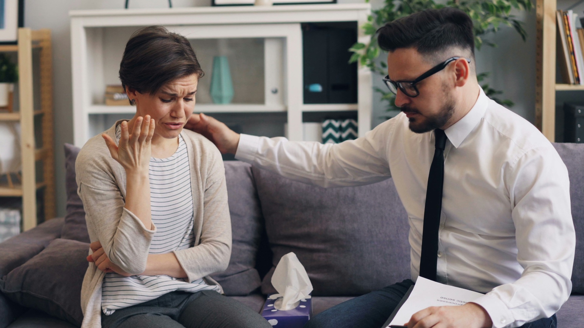 a man and a woman sitting on a couch