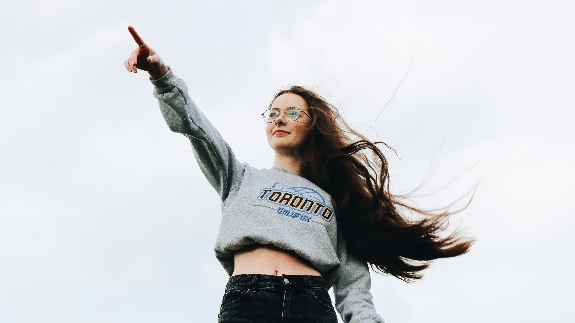 woman pointing using her right hand