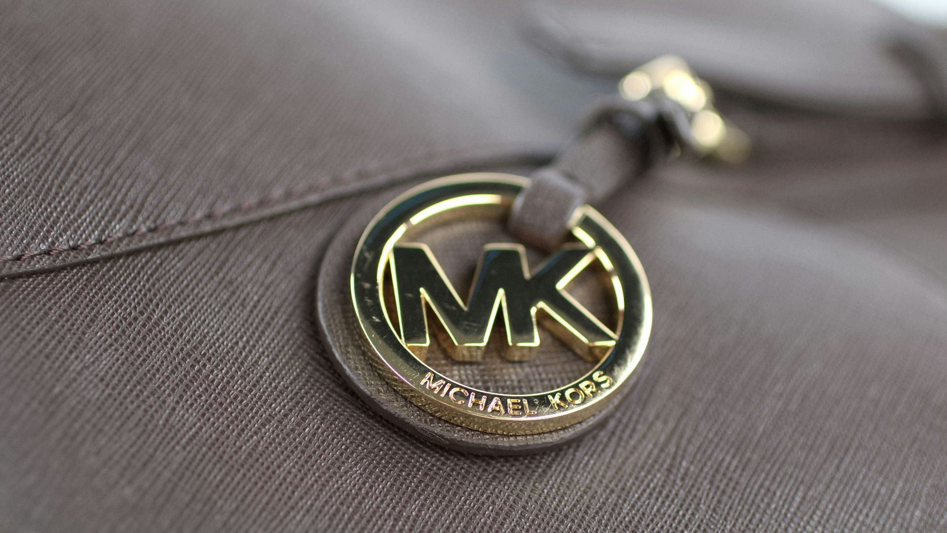 a close up of a michael kors bag