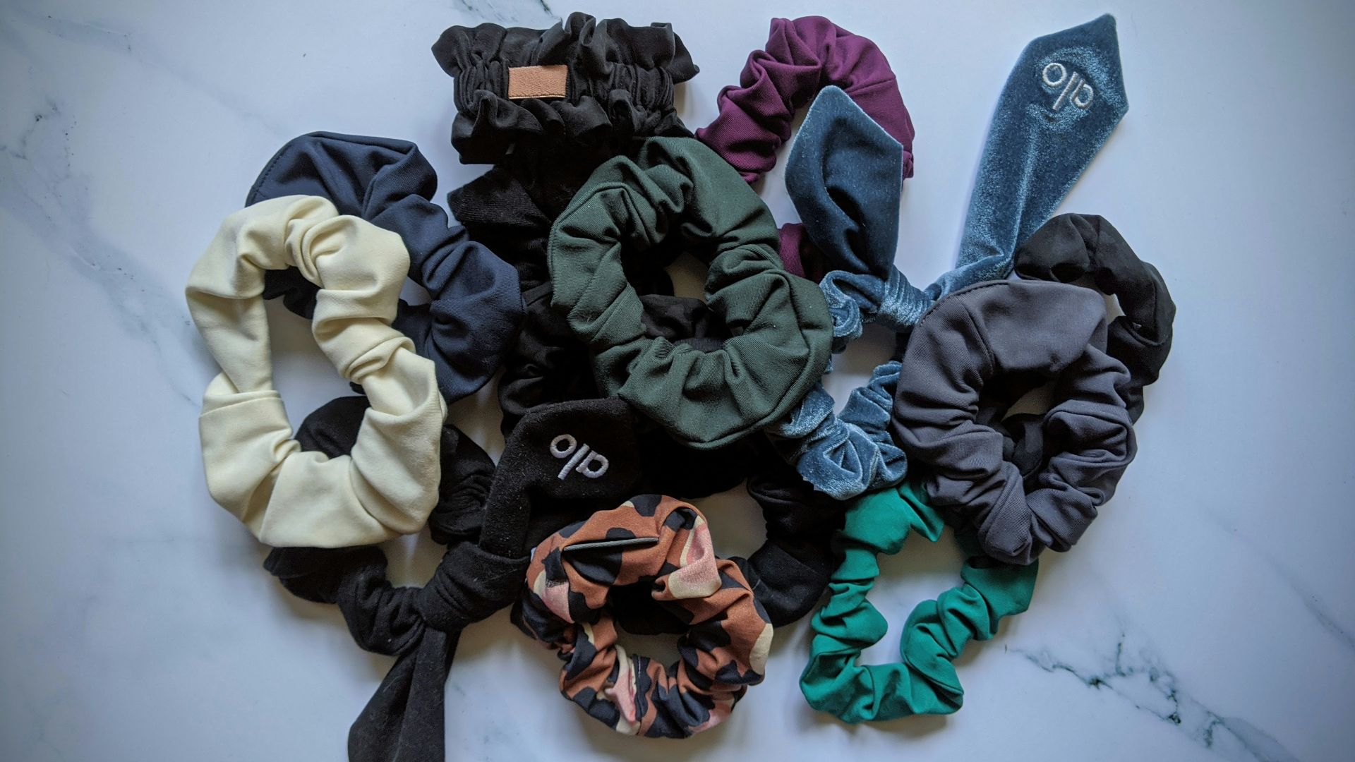 blue denim jeans with black and green ribbon