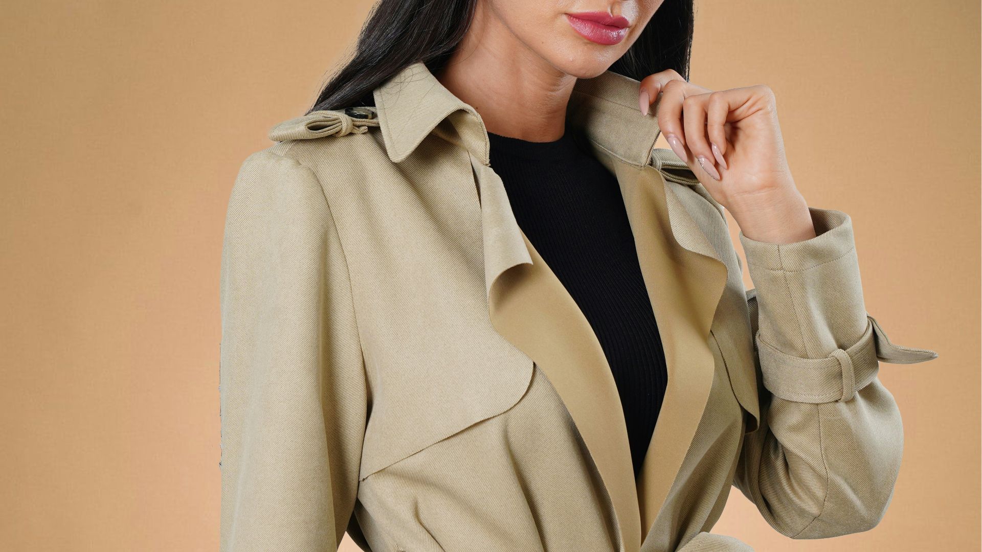 a woman in a trench coat posing for a picture