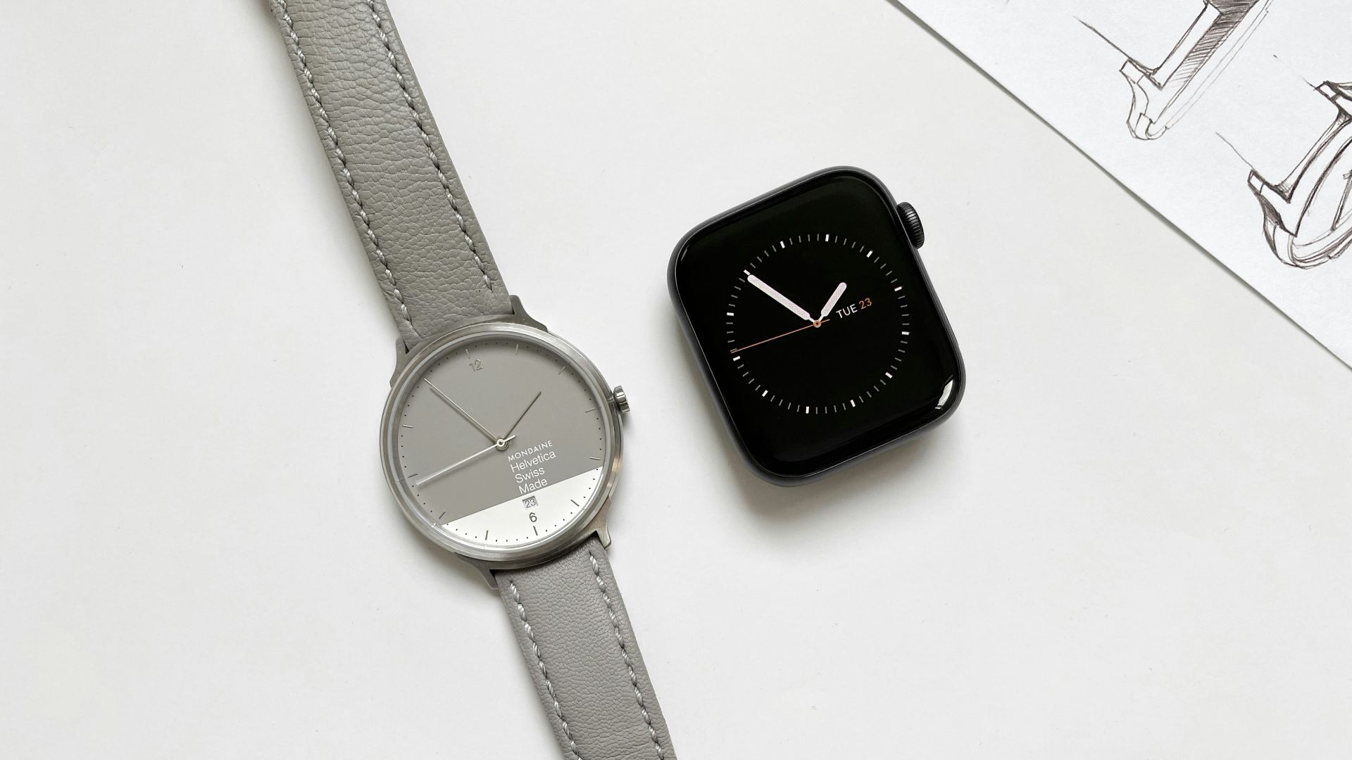 an apple watch sitting on top of a white table