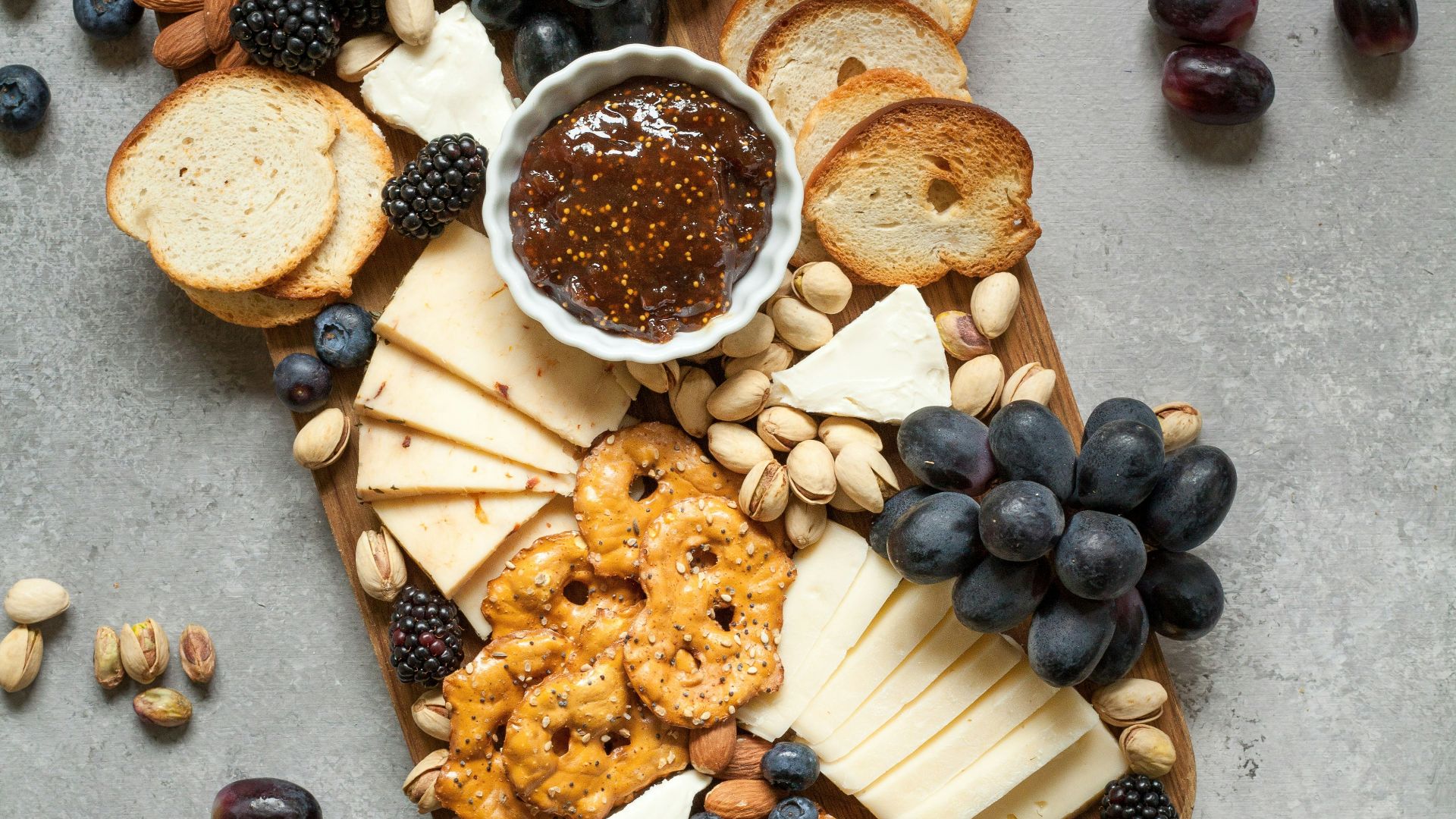 baked breads and cookies on brown wooden board