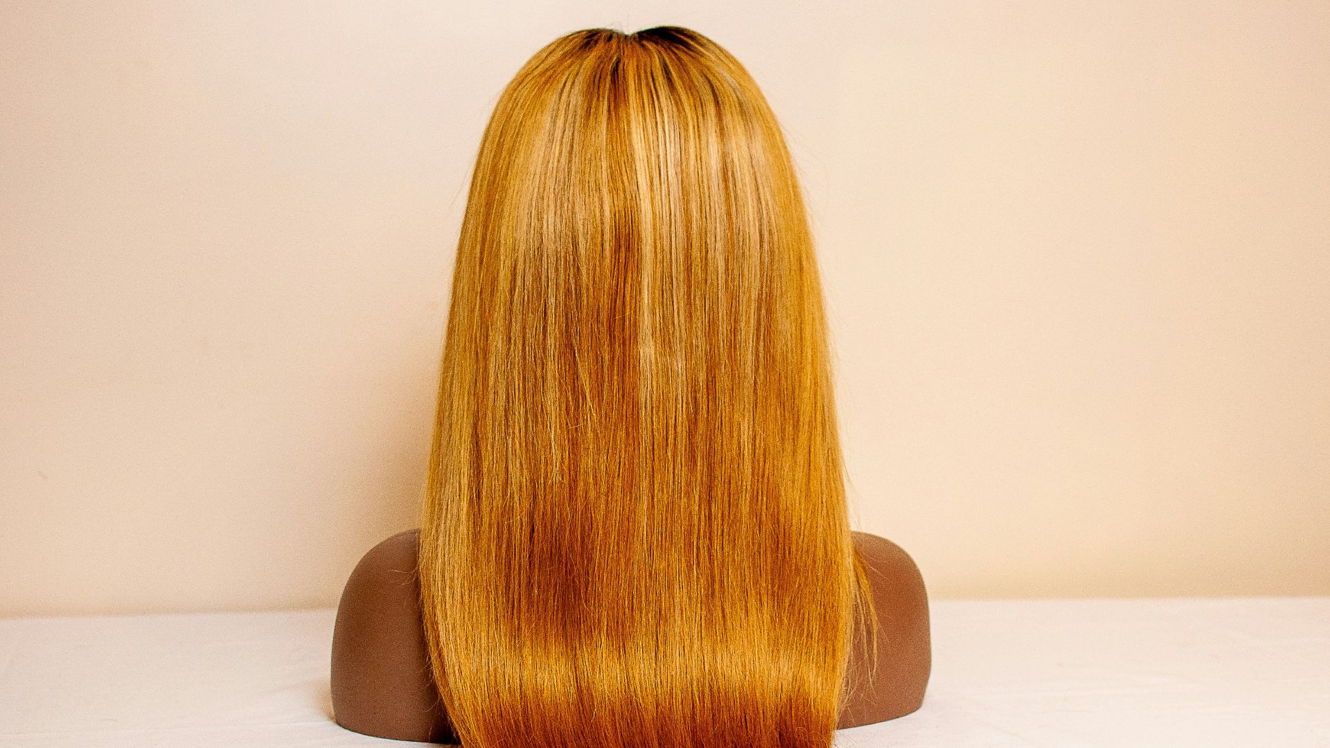 a woman's head on a white surface