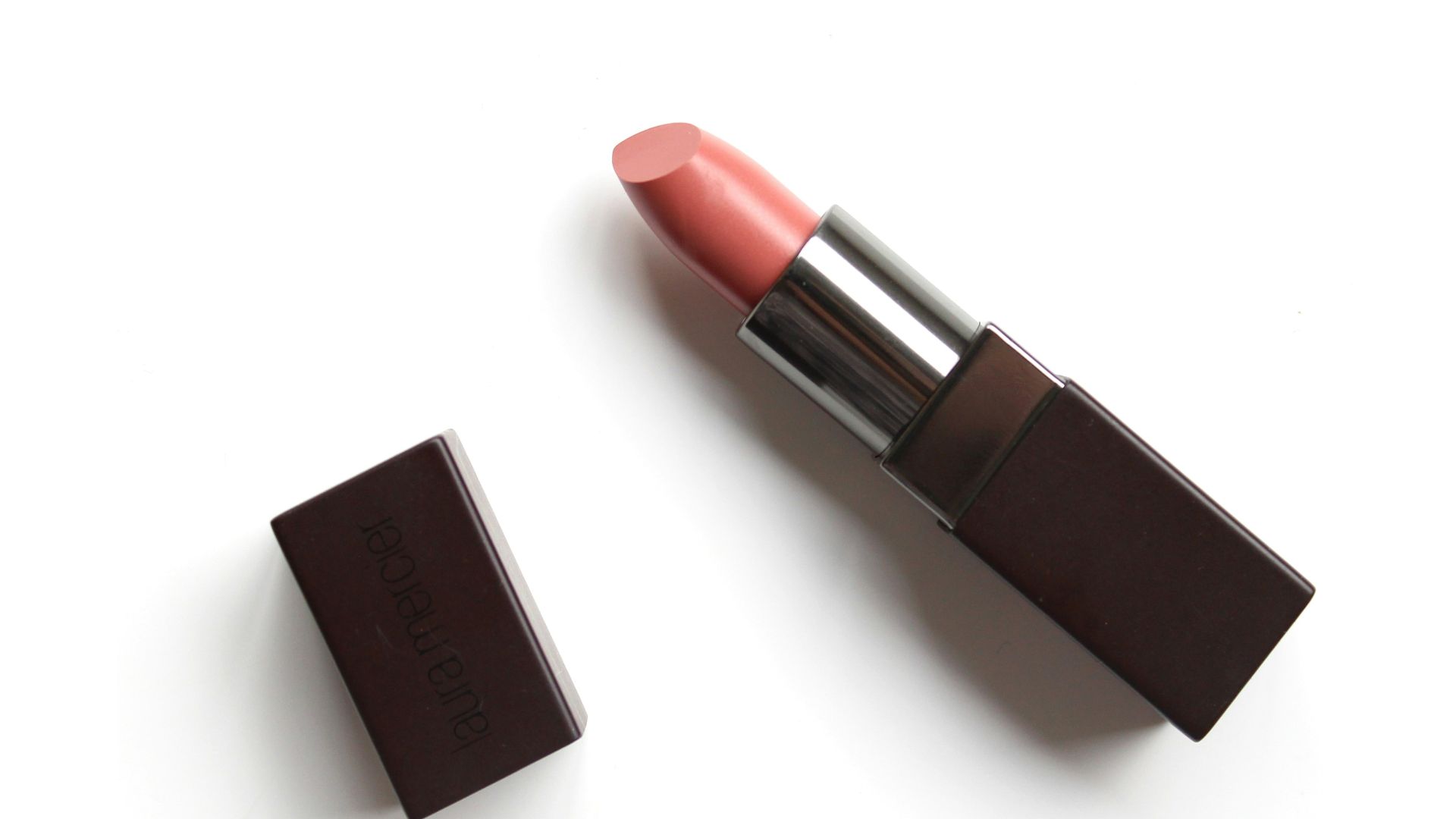 red lipstick on white surface