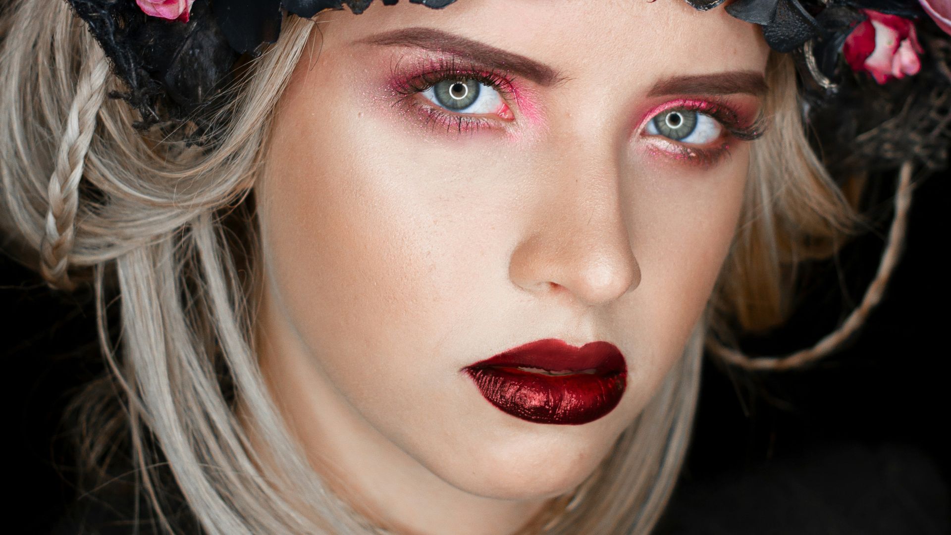 woman wearing black and purple flower headdress