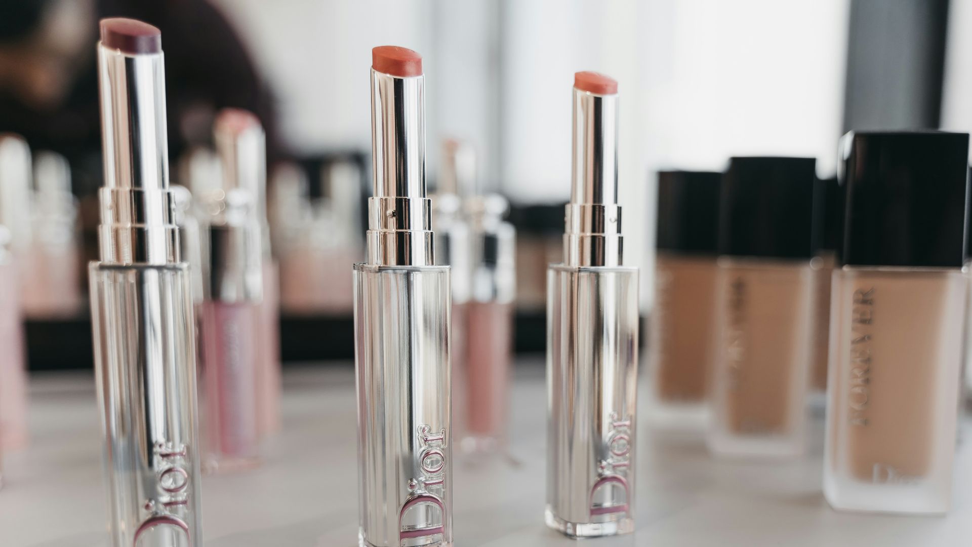 pink and silver nail polish bottles