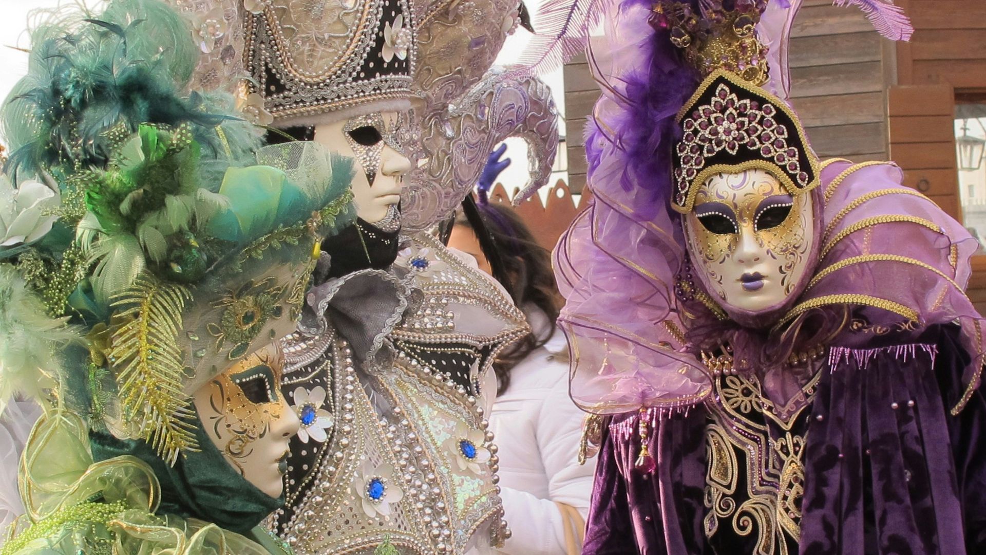 woman in purple and gold dress with gold crown