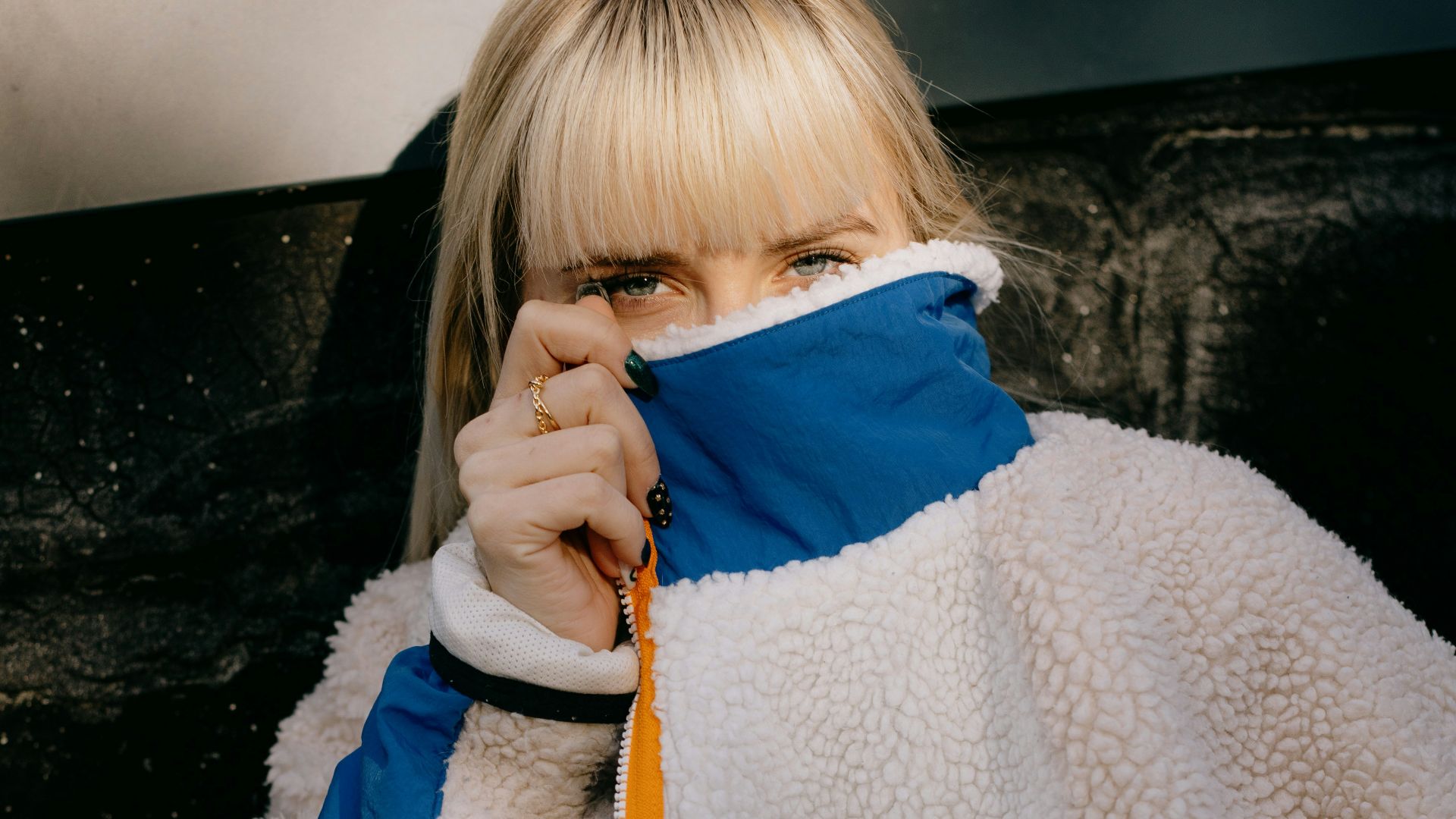 girl in blue and white jacket