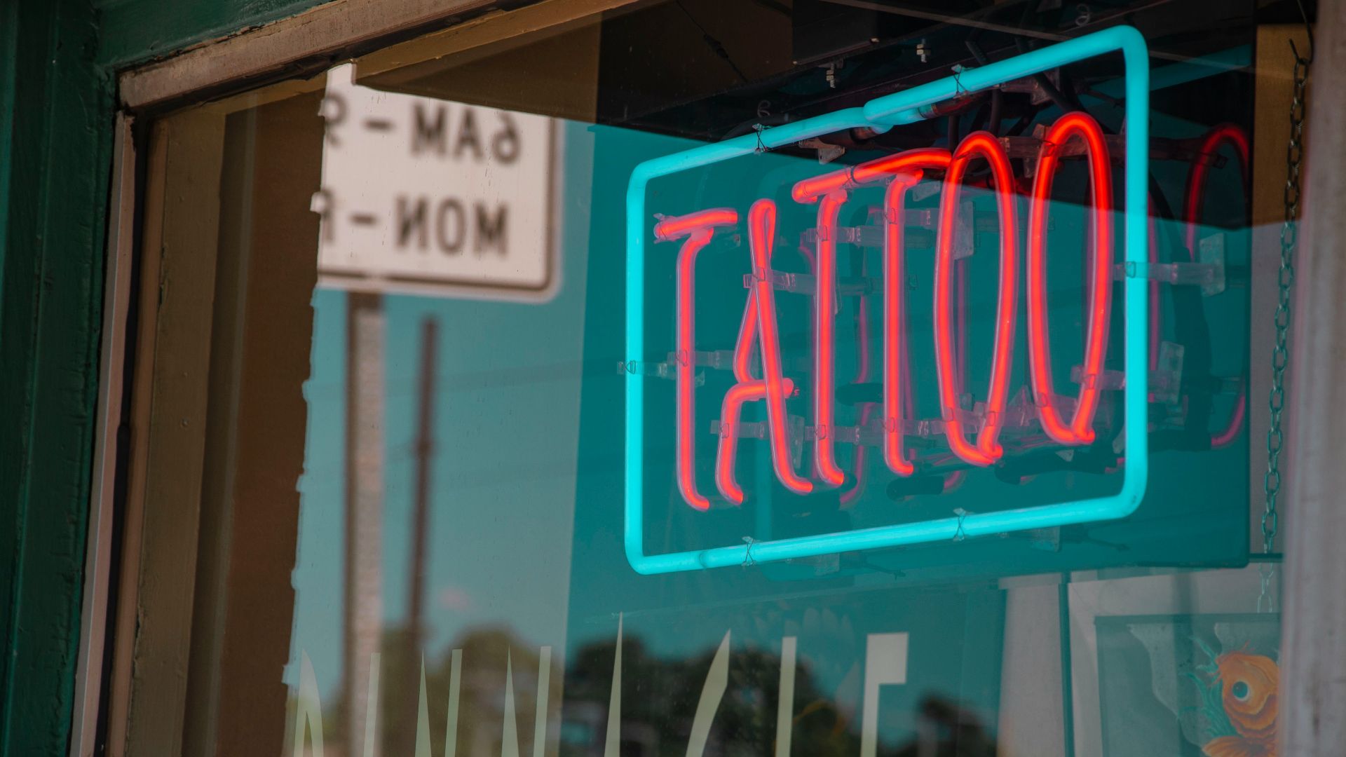 lighted red and green Tattoo neon signage