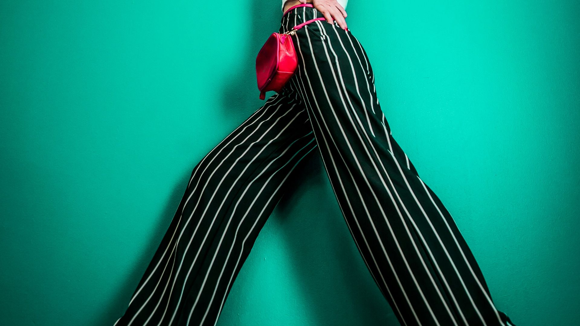 posing woman in white sleeveless top