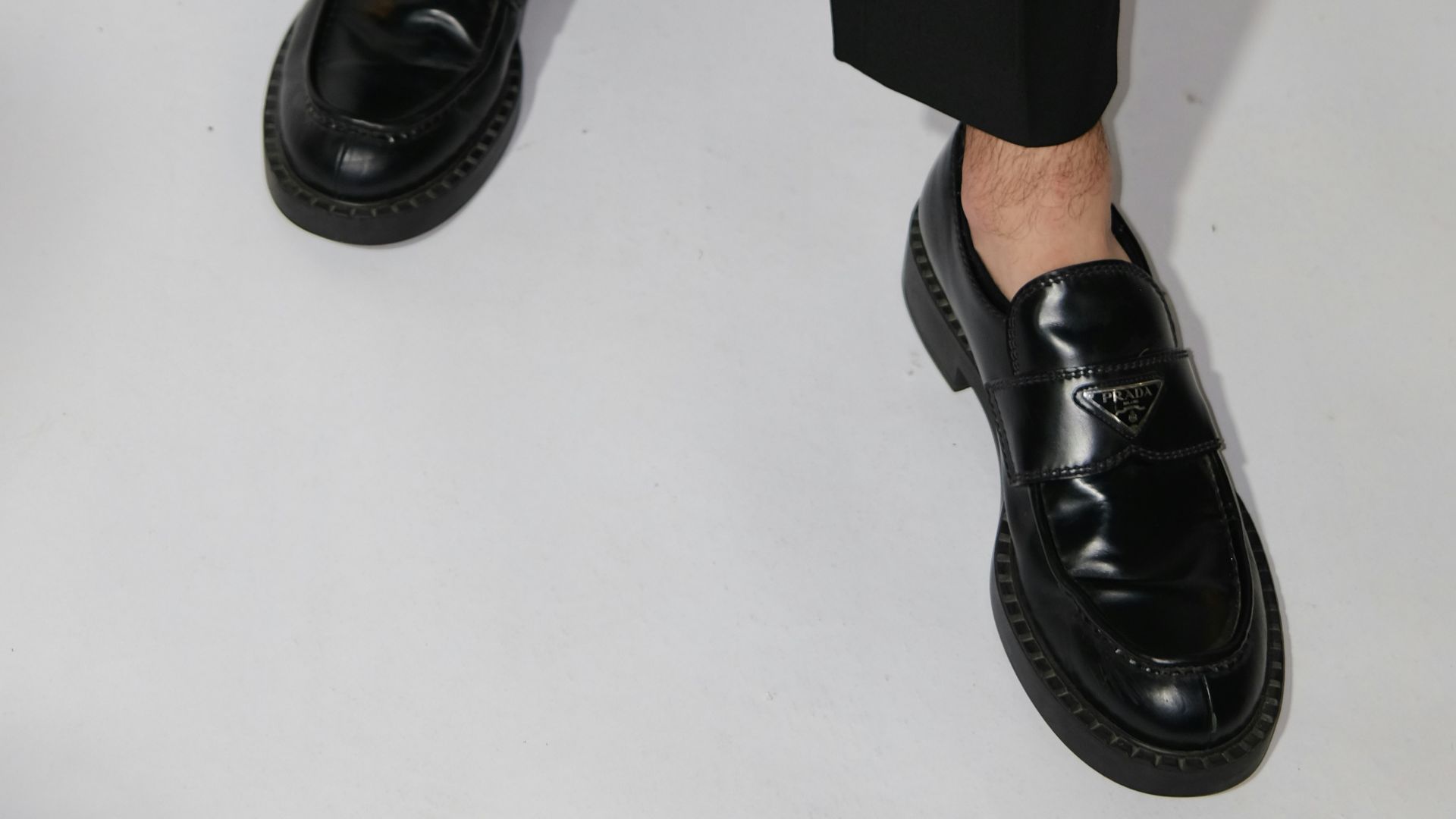 Black loafers with white background