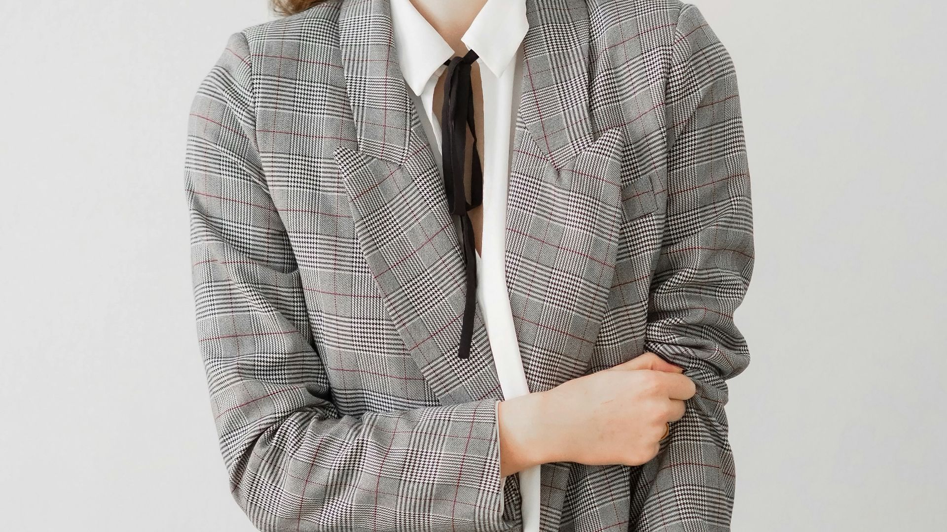 woman in gray blazer and black pants