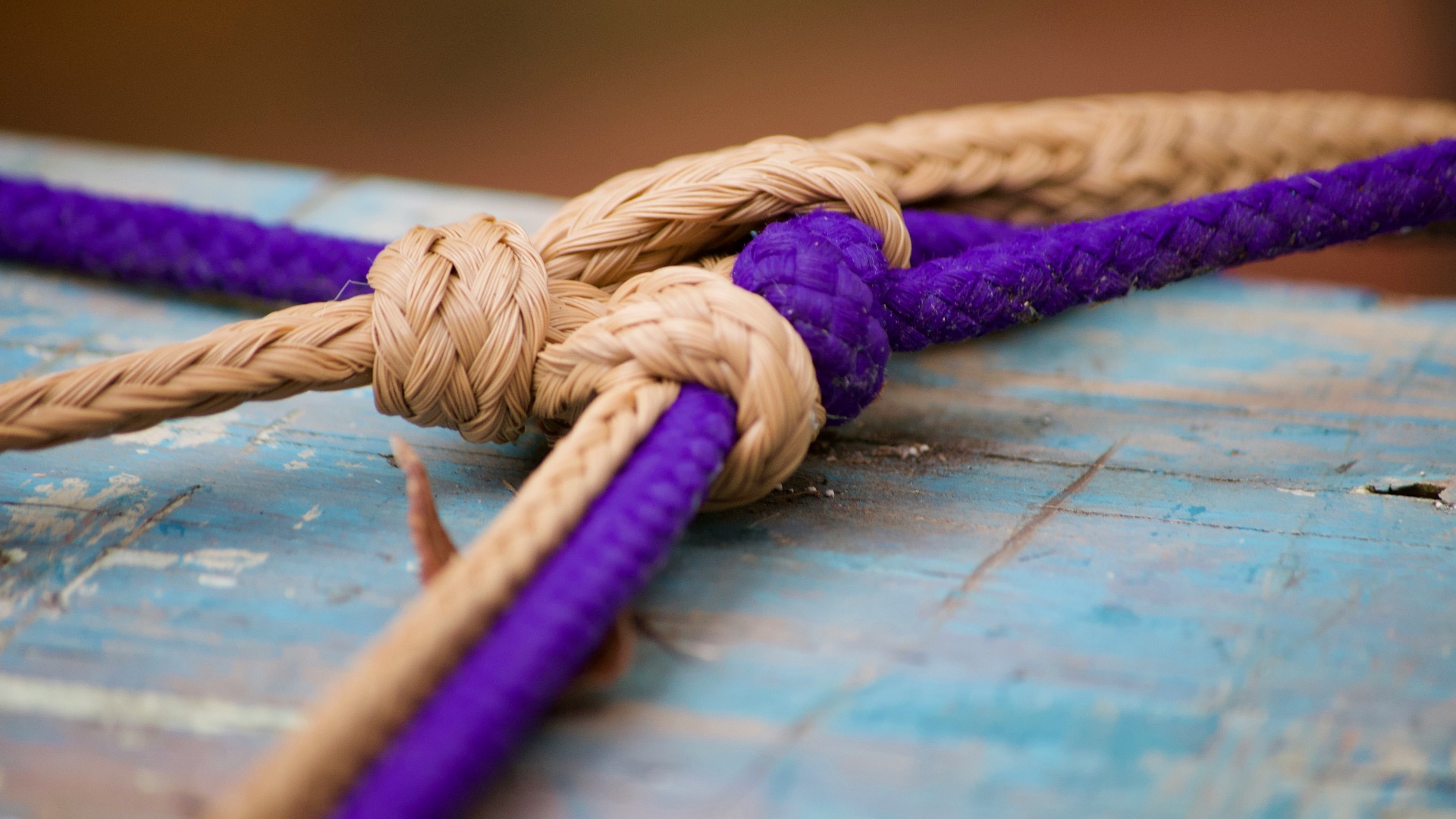 brown rope on blue wooden table