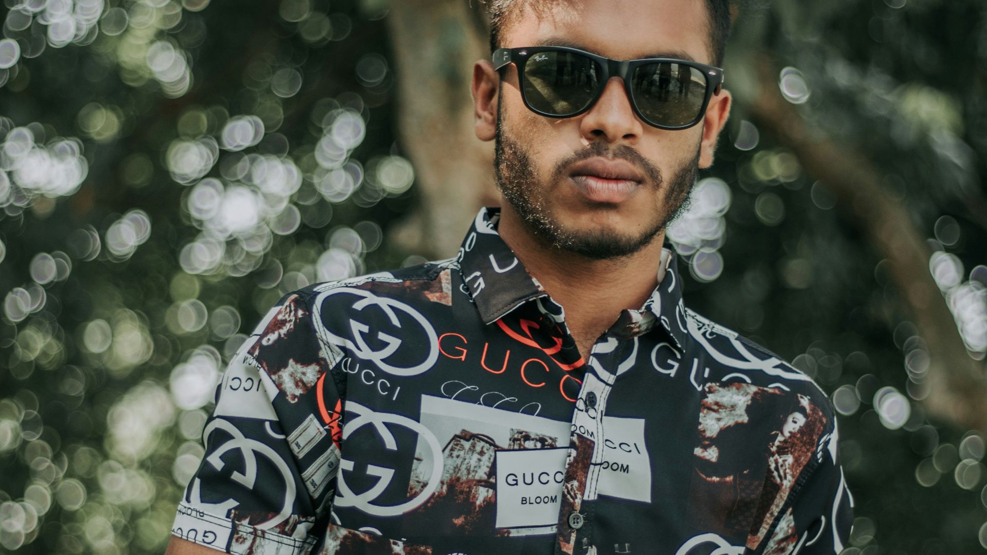 a man wearing a black shirt and sunglasses