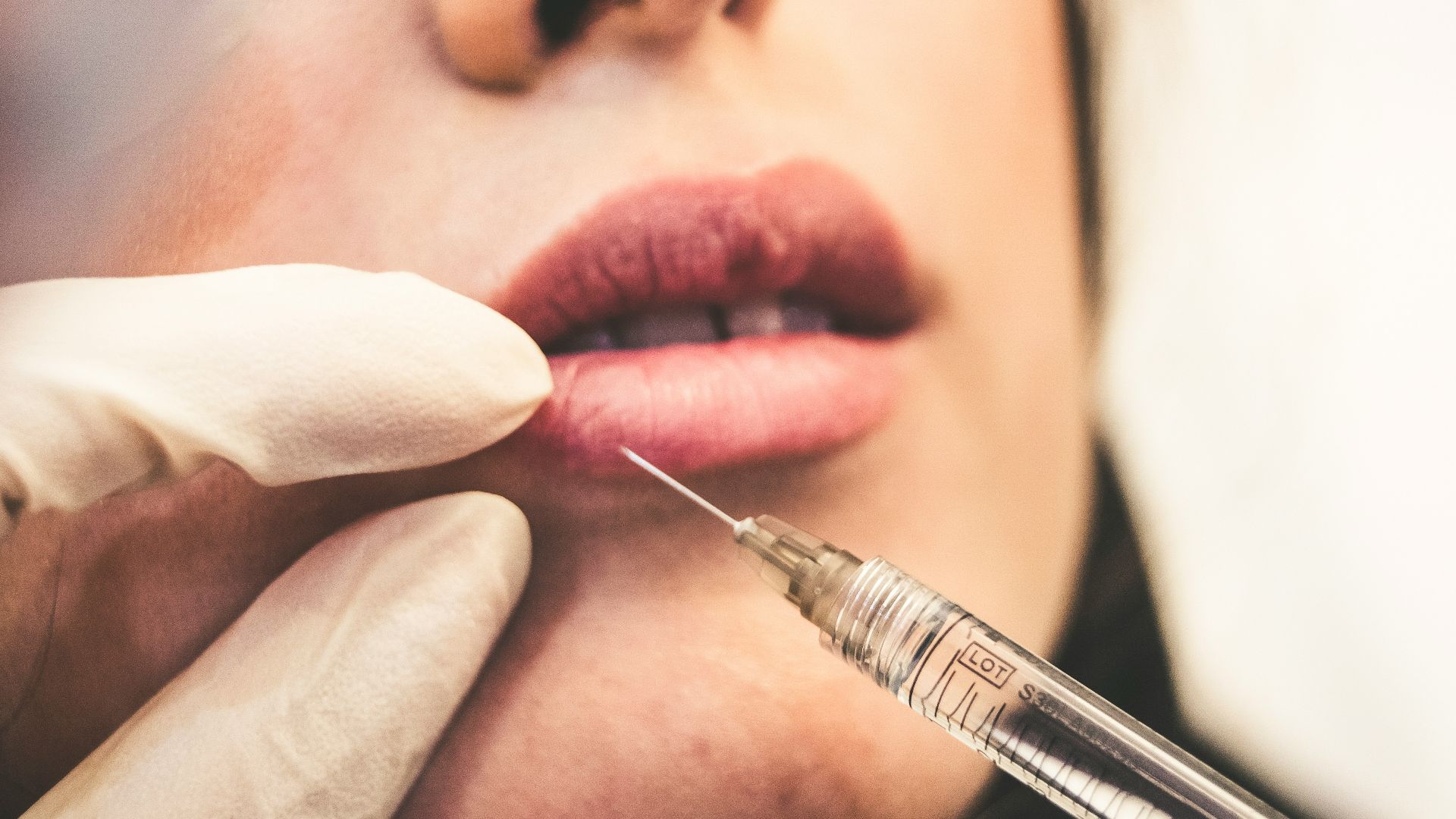 woman holding pen and white cotton candy
