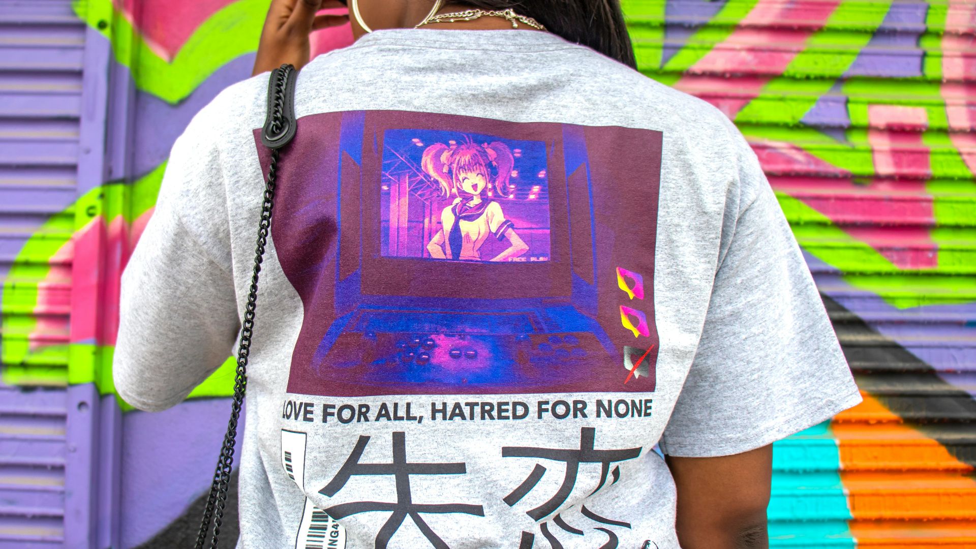 woman in gray crew neck t-shirt with black sling bag