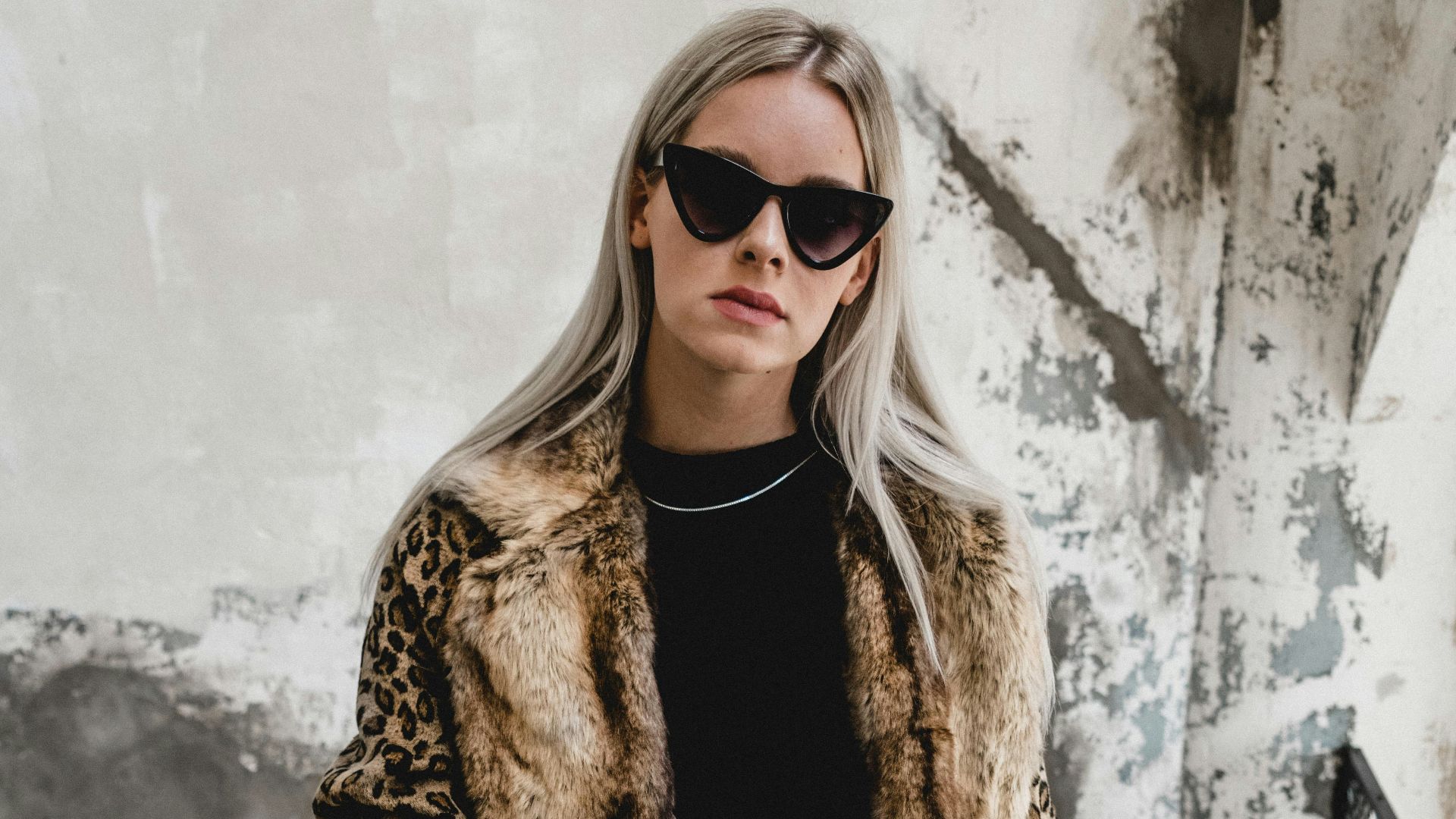 woman standing on gray stairs
