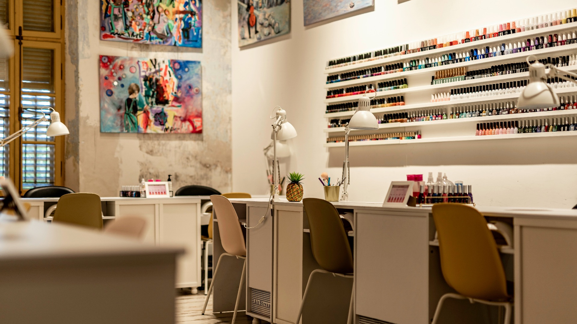a nail salon with chairs and a counter