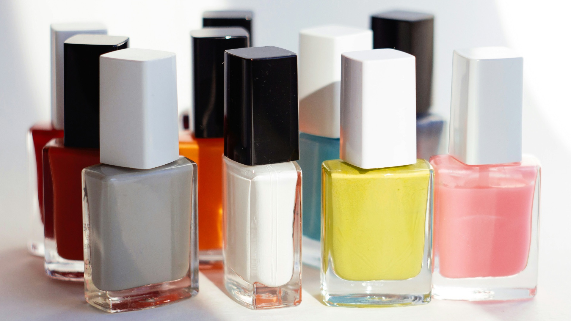 a group of different colored bottles