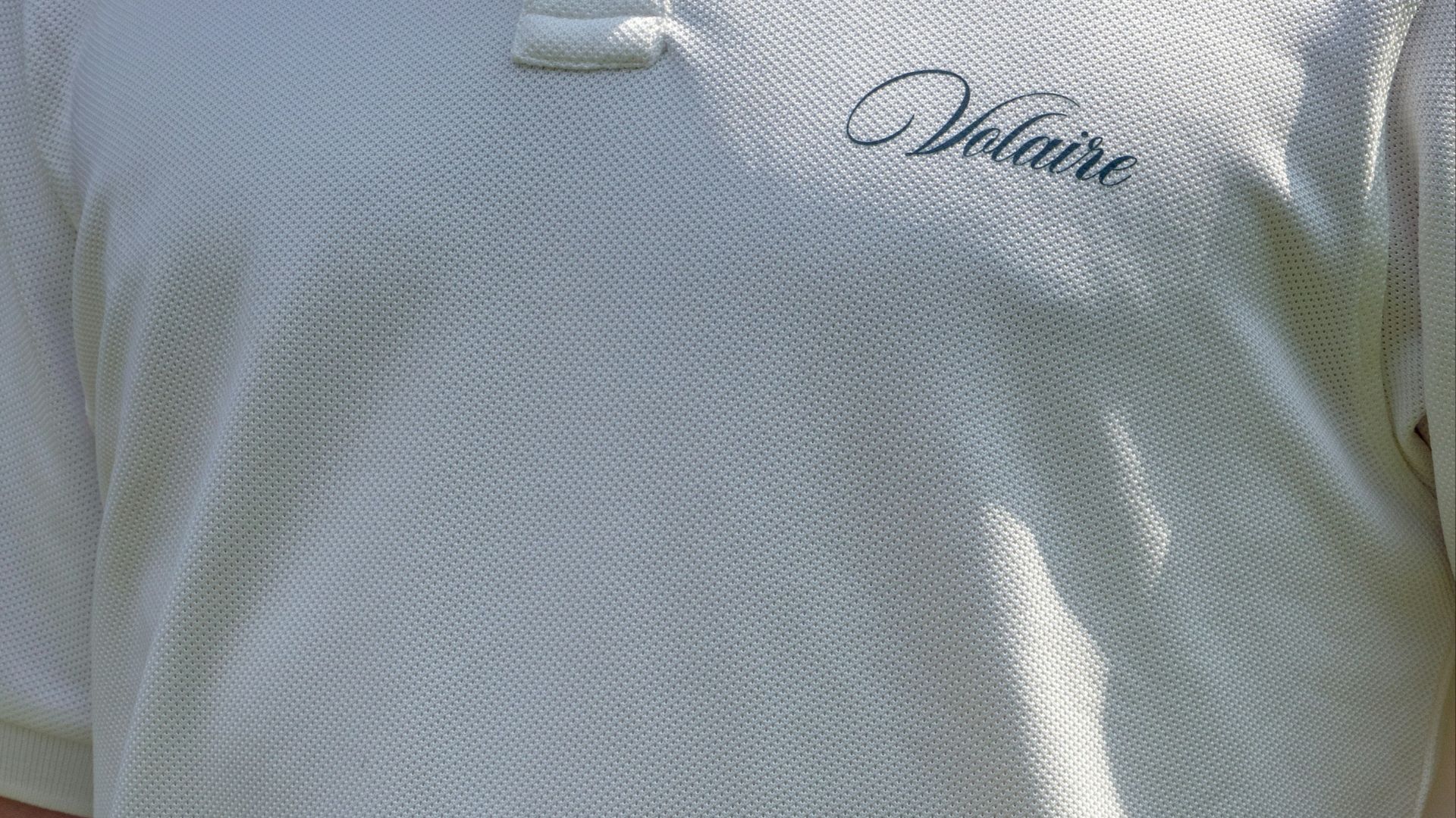 a close up of a person holding a tennis racquet