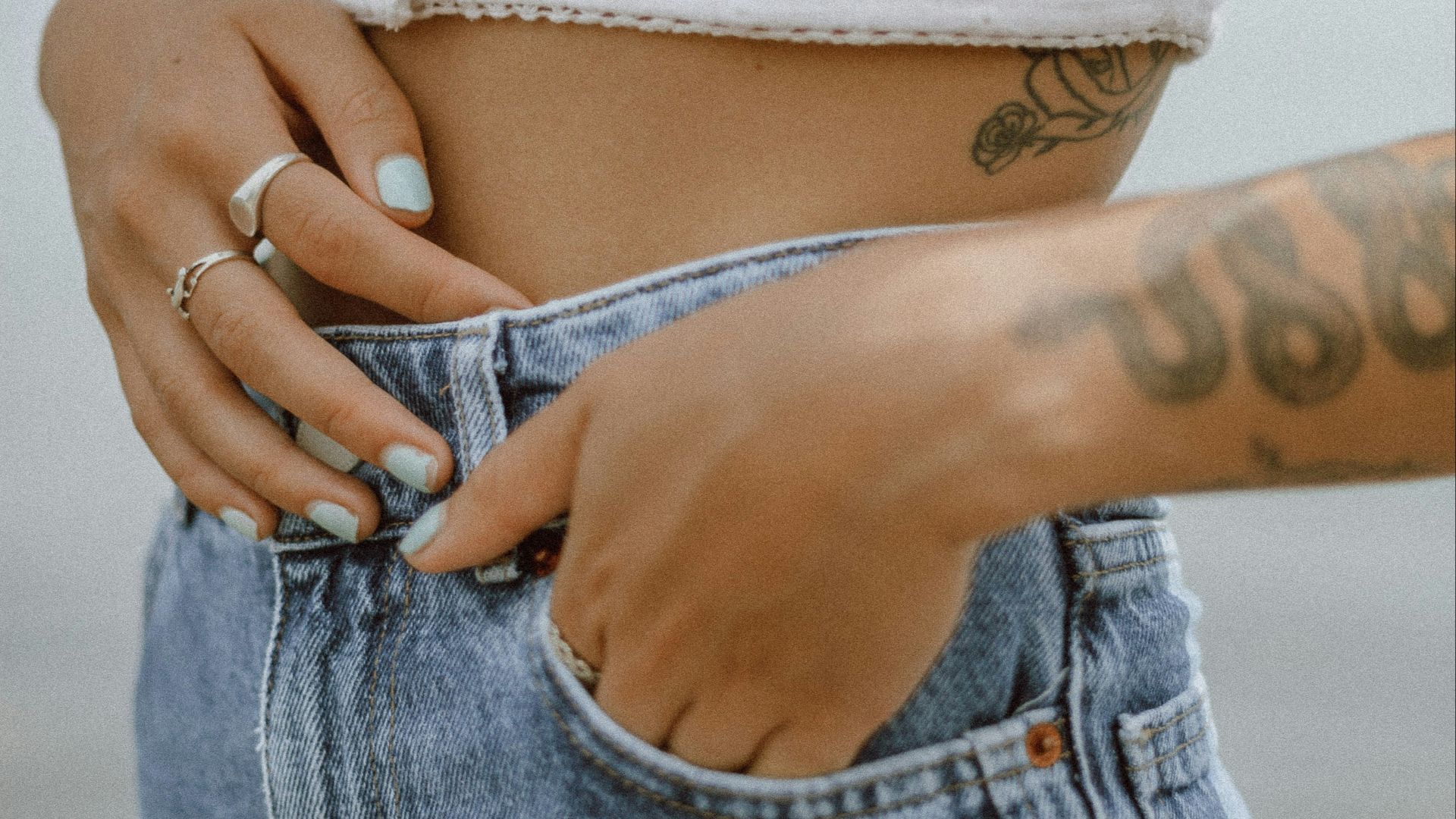 person with tattoo on left arm