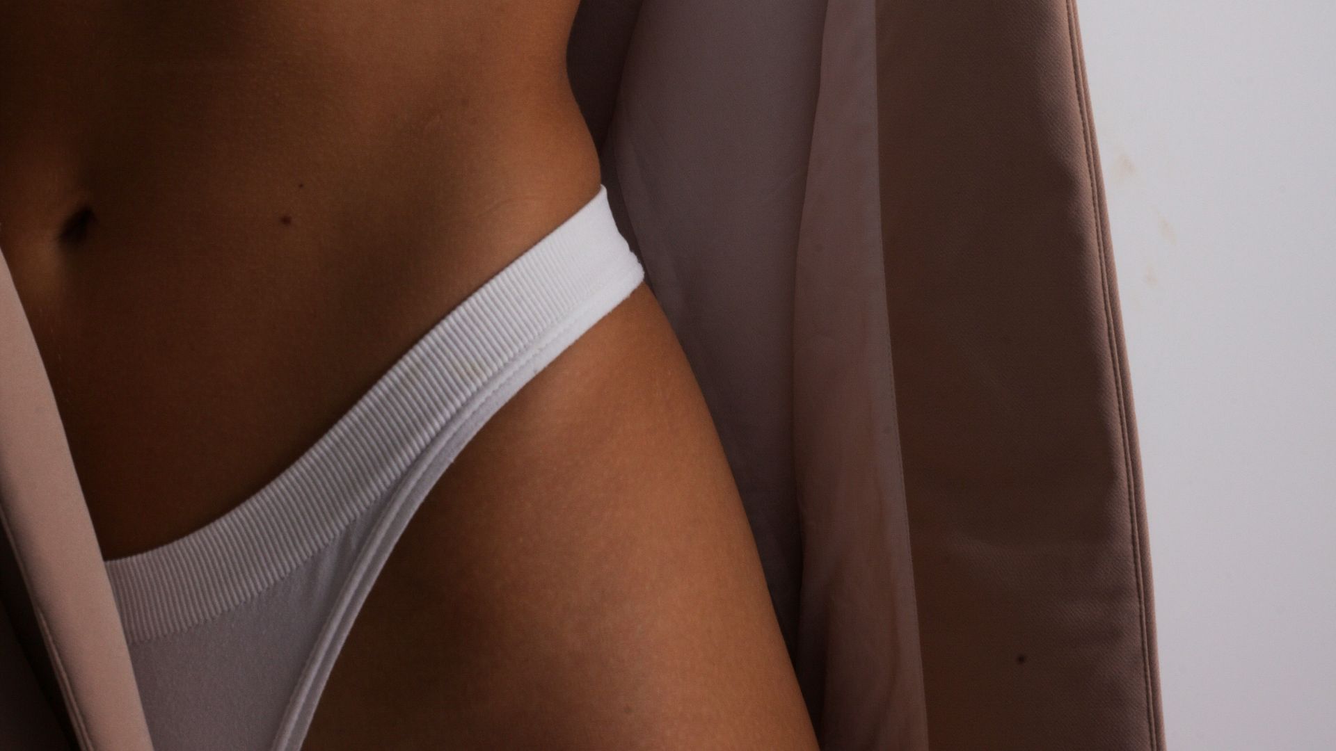 woman in white sports bra and white panty