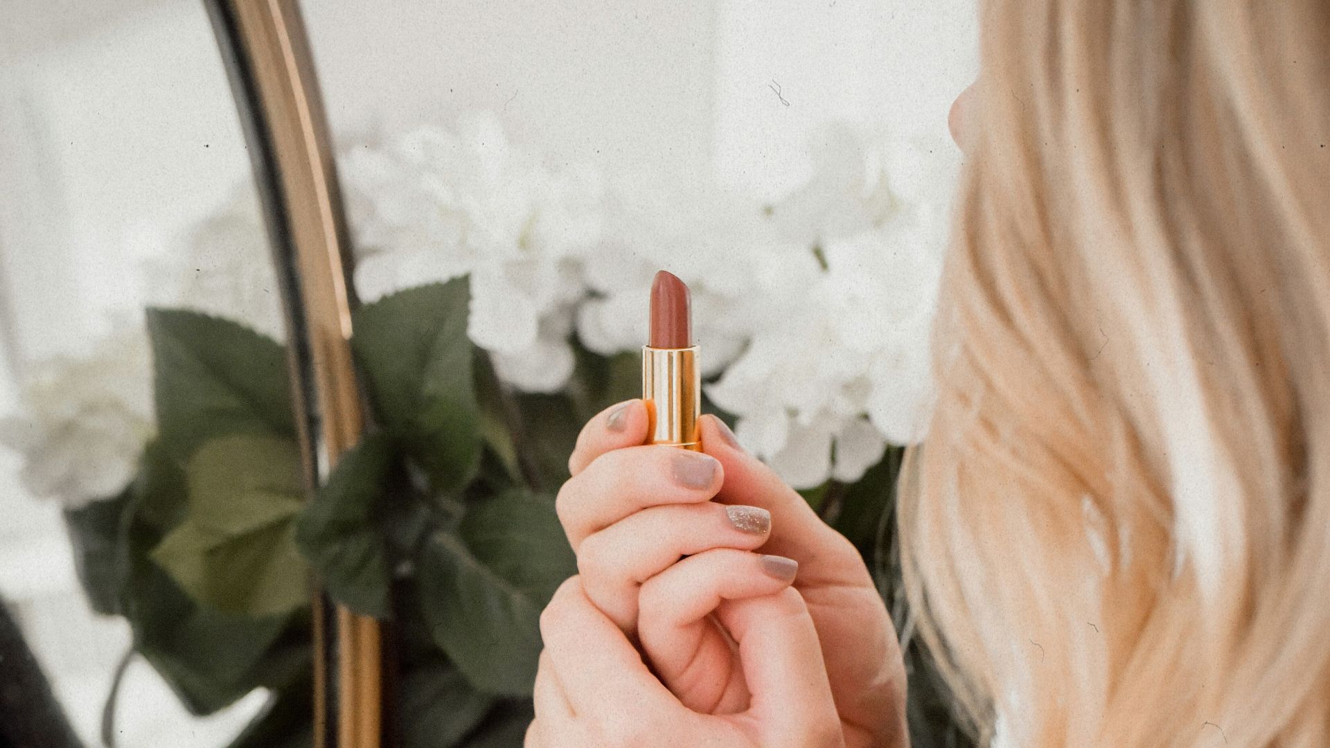woman in black and white striped long sleeve shirt holding cigarette stick