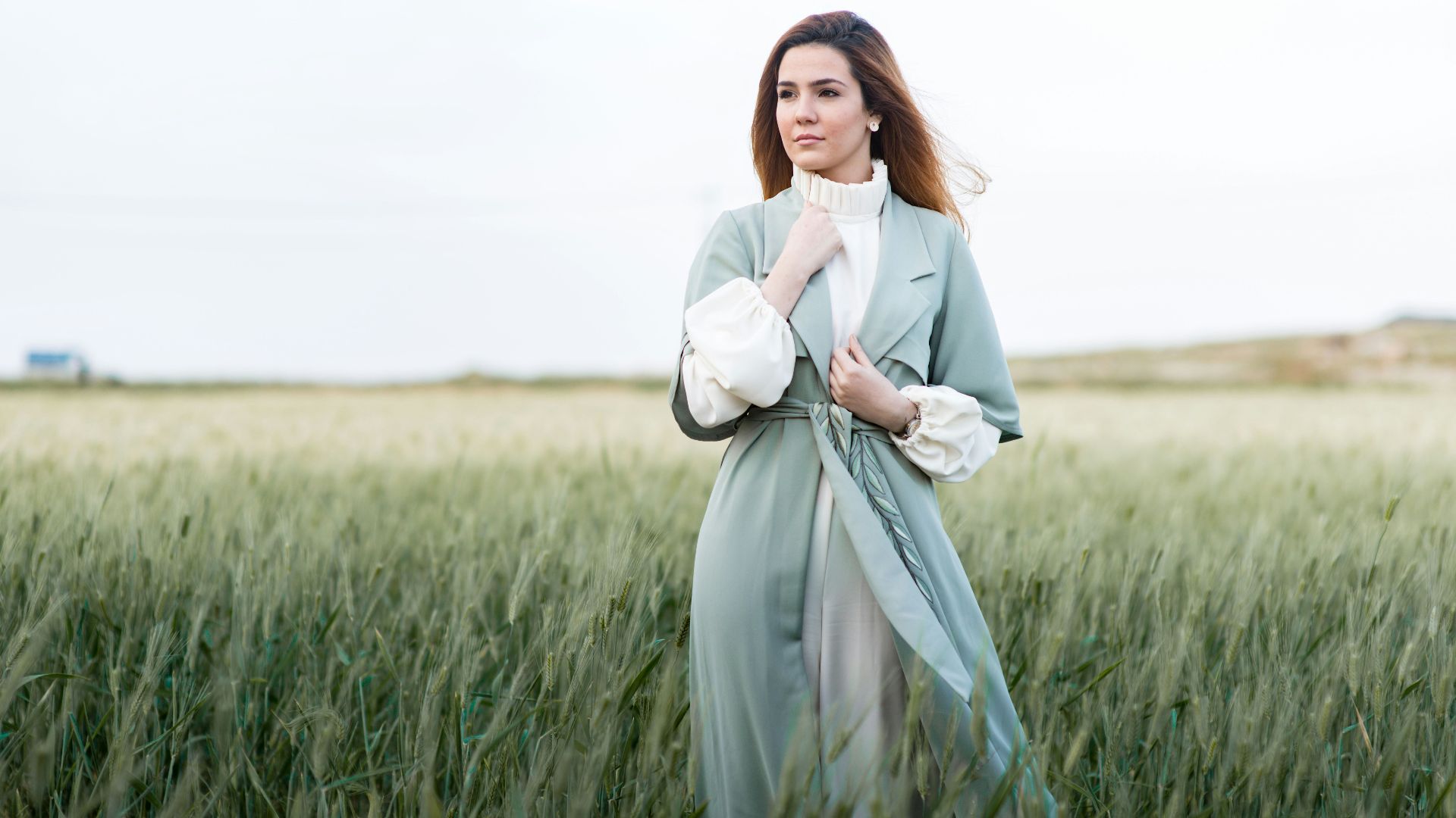 woman standing on grain fields