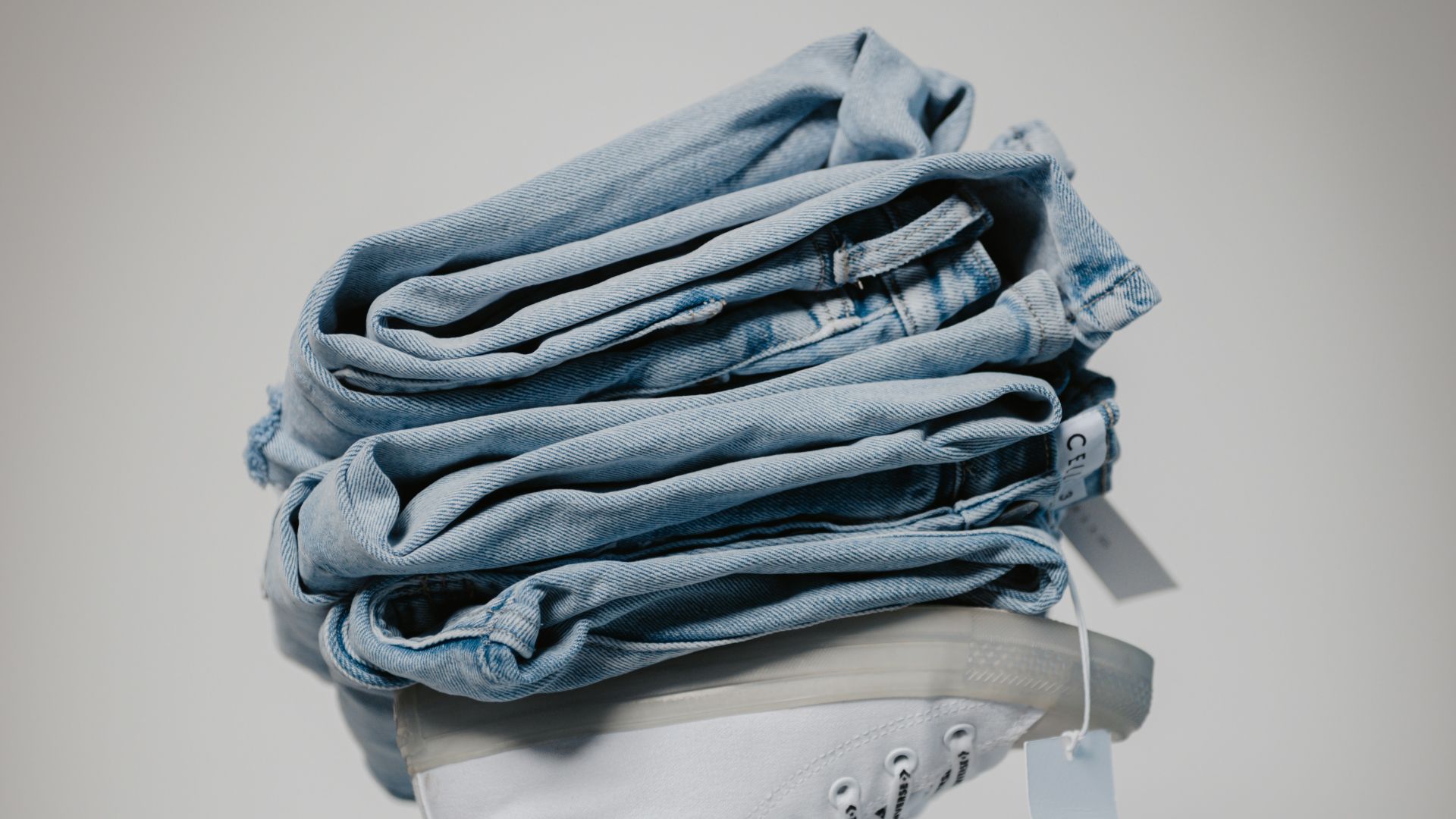 a stack of folded jeans in a jeans pocket